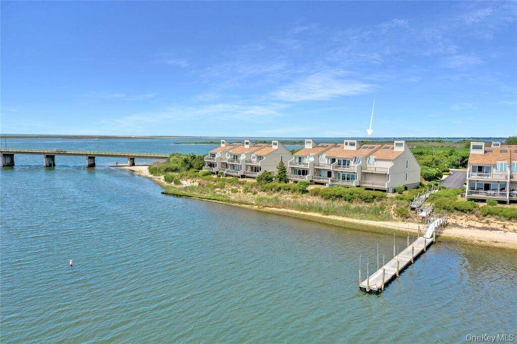 This Waters Edge Townhouse, Unit 7, offers spectacular bay and sunset views in a private peaceful waterfront community.