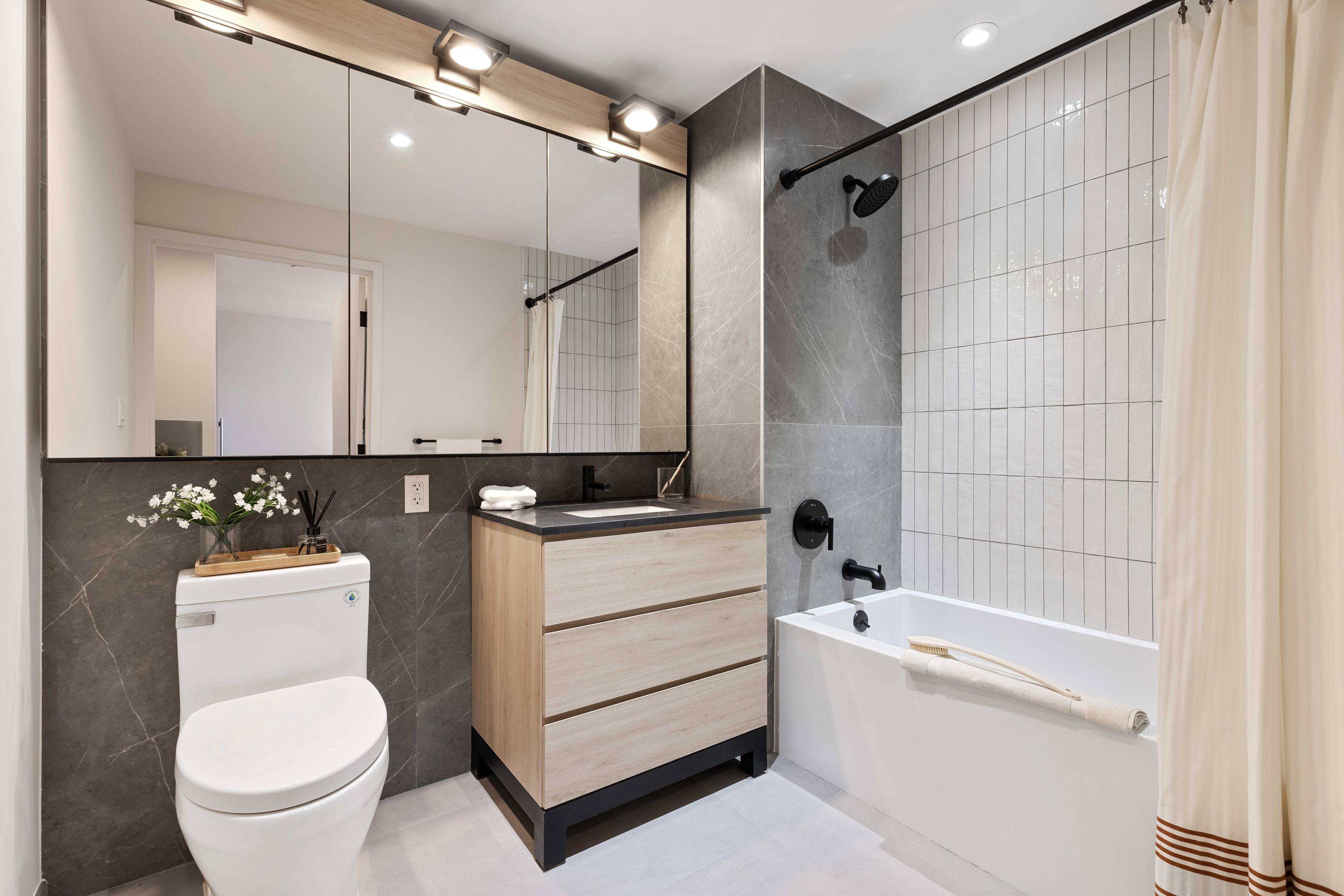 Beautiful one bedroom, one bathroom apartment with a private balcony ; featuring walk in closet, oversized windows, matte black and Calcutta finishes, custom tiled bathrooms, spacious closets, and in unit ...