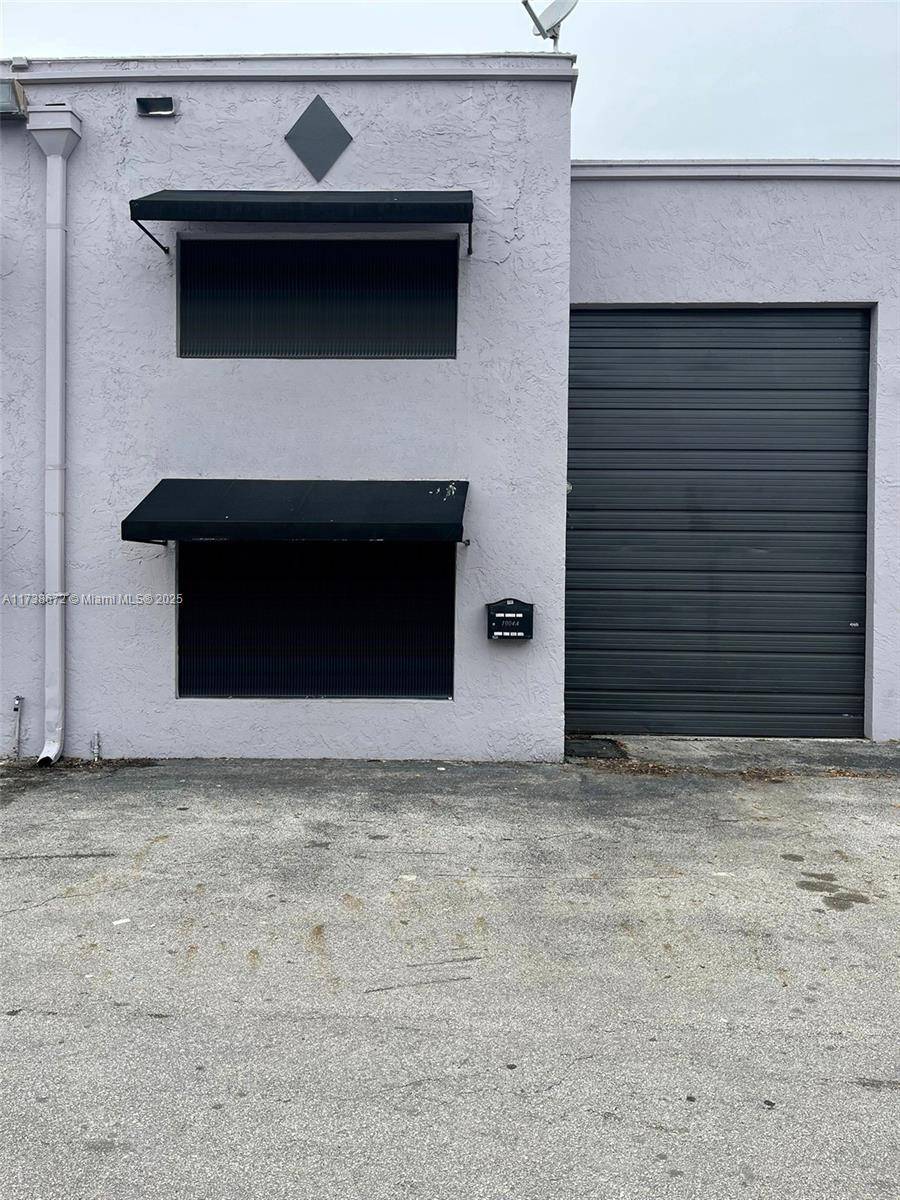 Spacious two story nicely updated warehouse with central A C, office space in the most convenient location, just off of Palmetto Expressway Okeechobee.