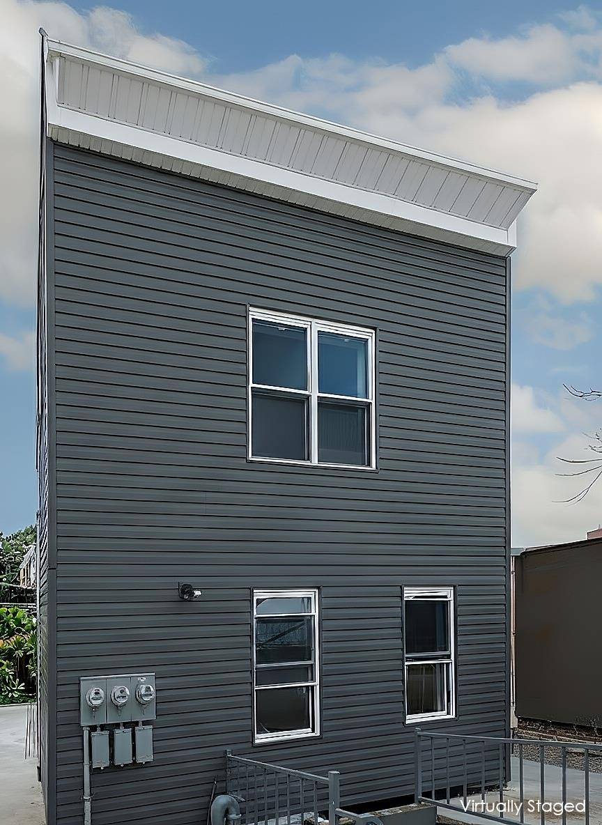 62 West 9th Street A Pristine Two Family Townhouse at the Crossroads of Red Hook and Carroll Gardens.