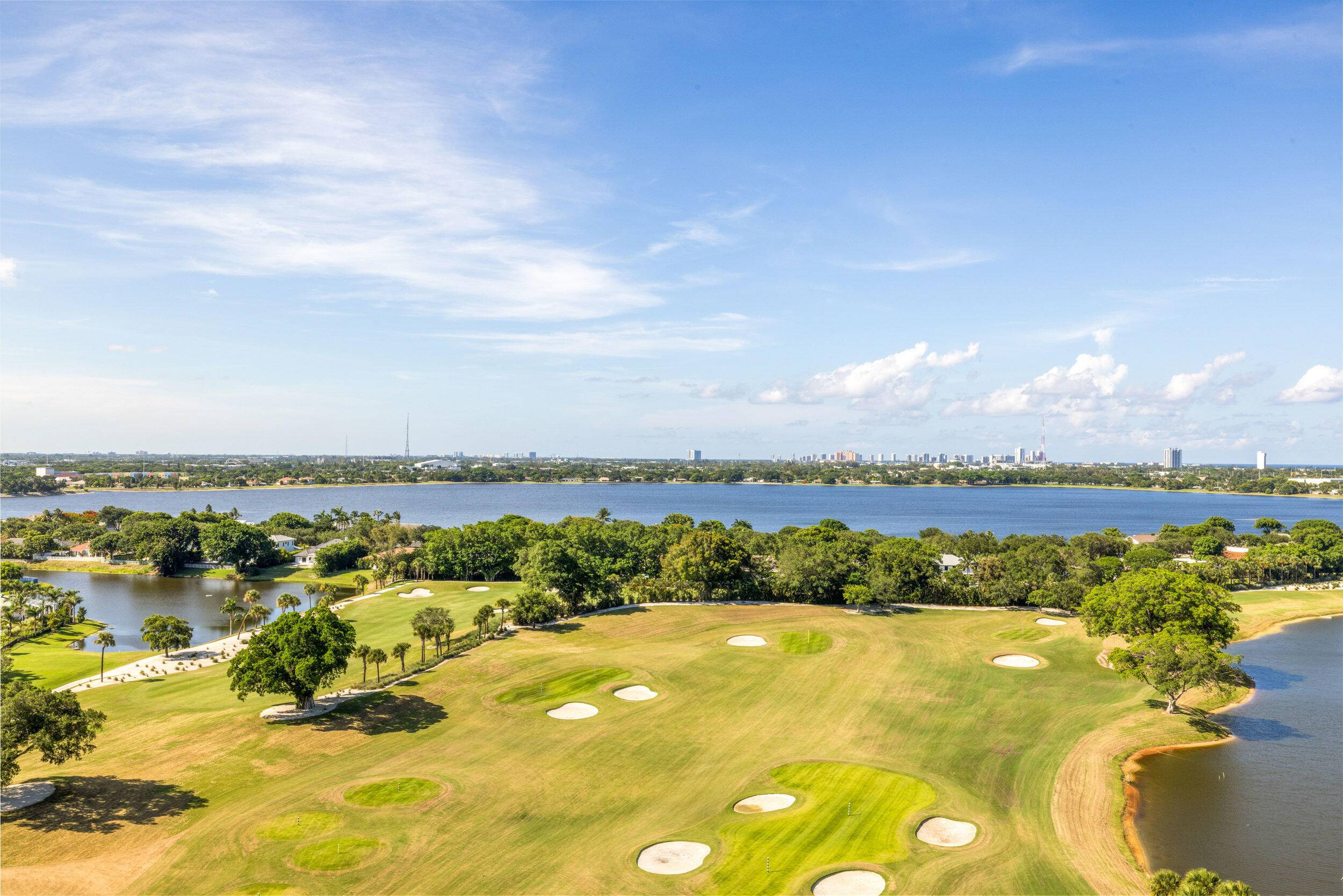 Enjoy sweeping, unobstructed views of Lake Mangonia and the Jack Nicklaus designed golf course from this beautifully renovated condo in the heart of West Palm Beach.