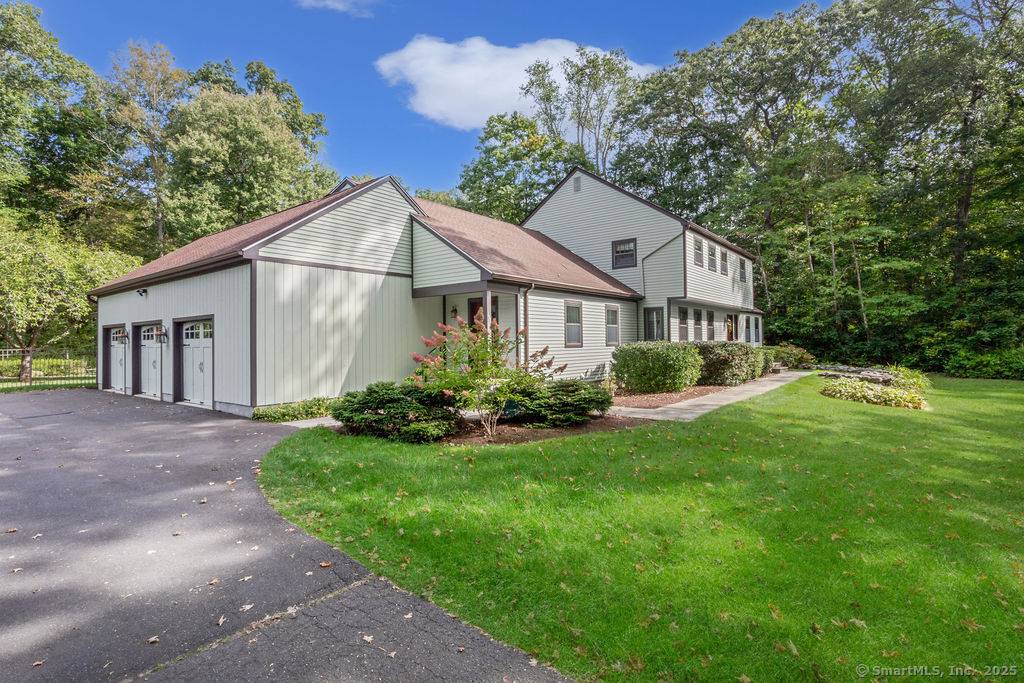 Spacious Colonial close to Town Center boasting unique first floor, handicap accessible, in law apartment with separate entrance, full kitchen, large family room and bedroom suite.