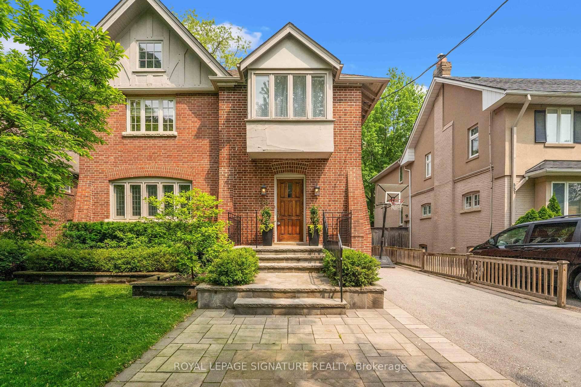 Majestic Lawrence Park offering almost 5000 sq ft of living, perched high above renowned Alexander Muir Park.