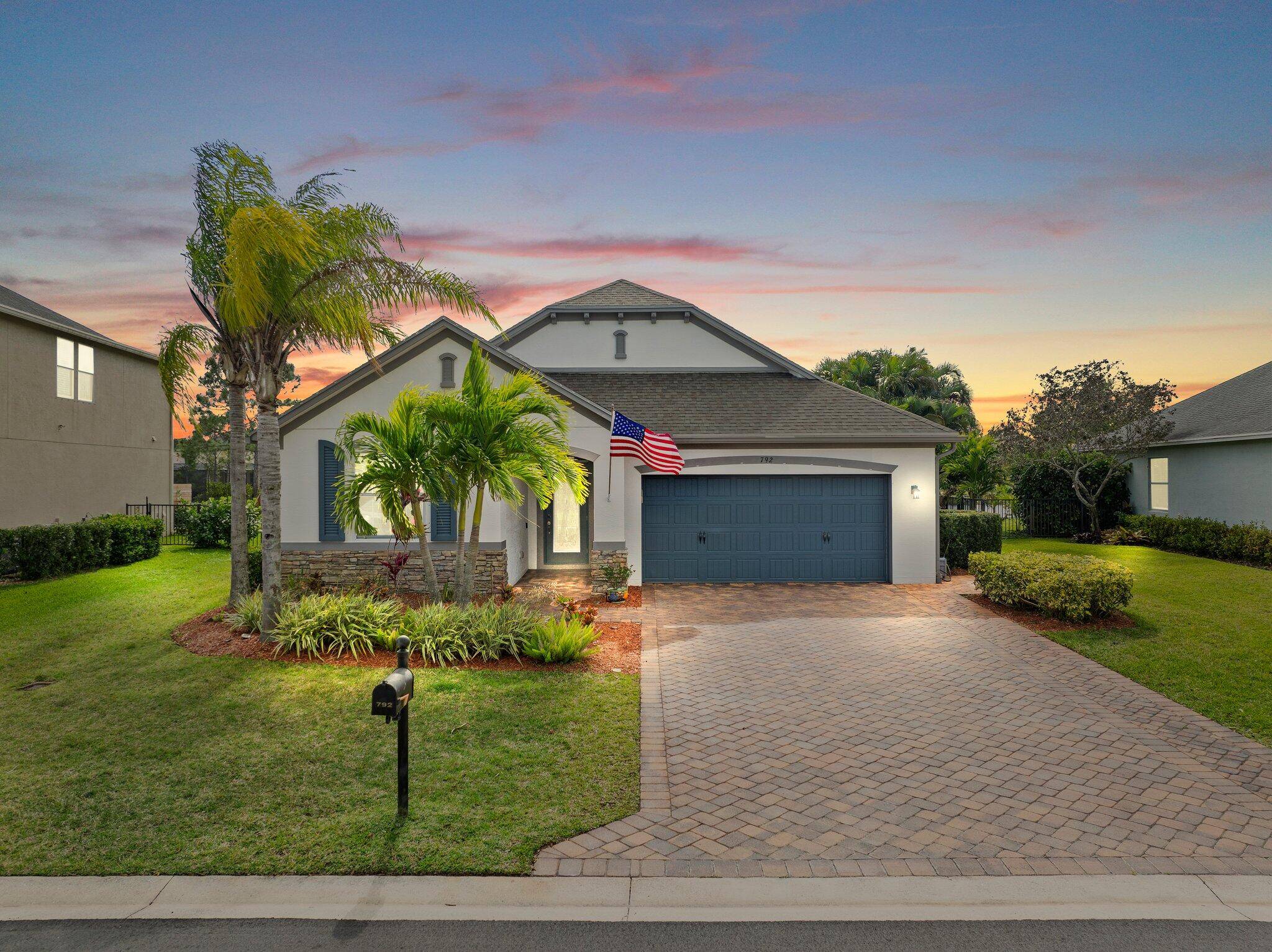 Meticulous 3 bedroom 2 bathroom 2 car garage pool home with lake views in the sought after community of Copperleaf in Palm City.