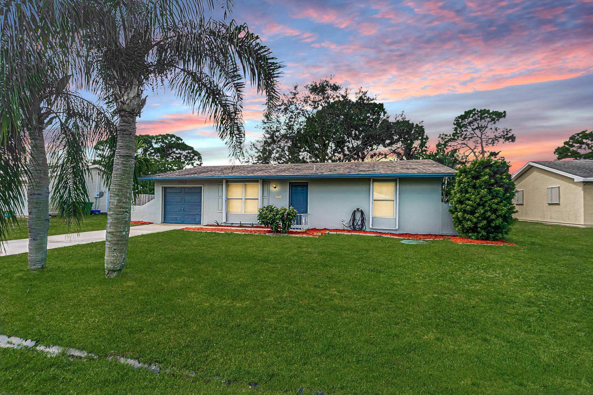 Solid CBS construction 2 bedroom, 2 bath home with versatile garage conversion offers easy 3rd bedroom complete with wall A C and private entrance ideal for guests, remote work, or ...