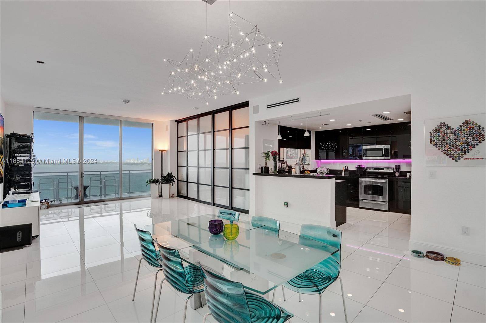 Breathtaking Bay Views catch your eye as you step into this renovated updated NW SE Corner 2BD Den 2.