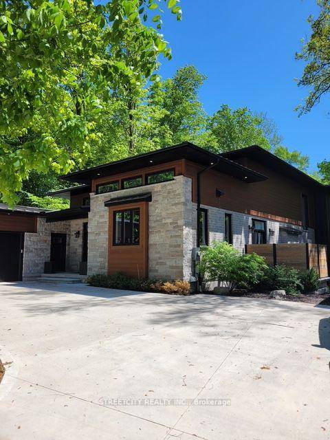 This architecturally striking home offers the perfect blend of modern luxury and natural serenity.