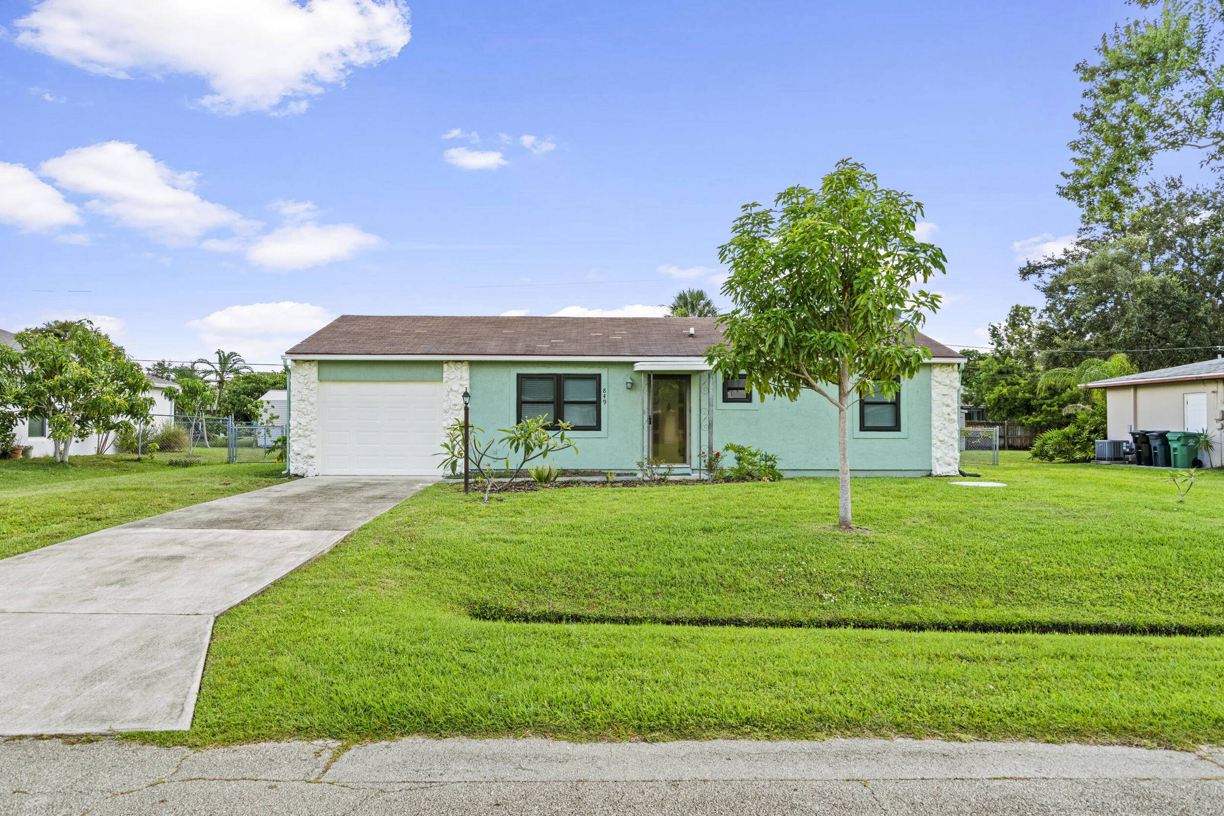 Move in ready 2BR 2BA CBS home with garage on a quiet street.