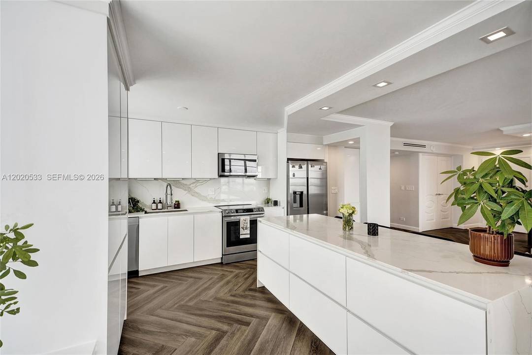 Largest 2BD 2BA corner unit in Winston Towers with rare 2 parking spaces, high floor positioning, and endless panoramic Ocean, Intracoastal, and city views in the heart of Sunny Isles ...