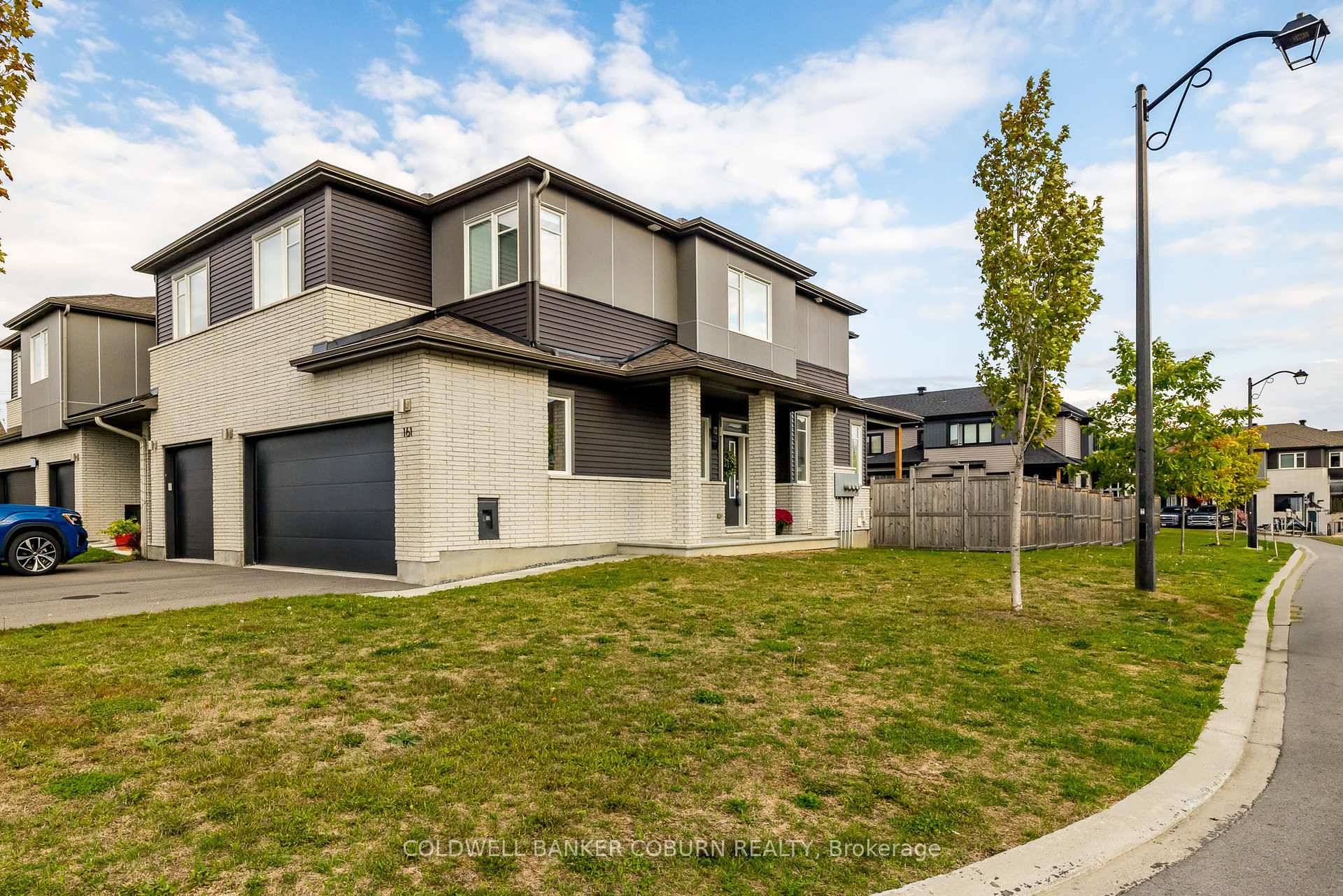 Meticulously maintained END UNIT with DOUBLE GARAGE, wide lot amp ; finished basement in the desirable Edenwylde community of Stittsville.