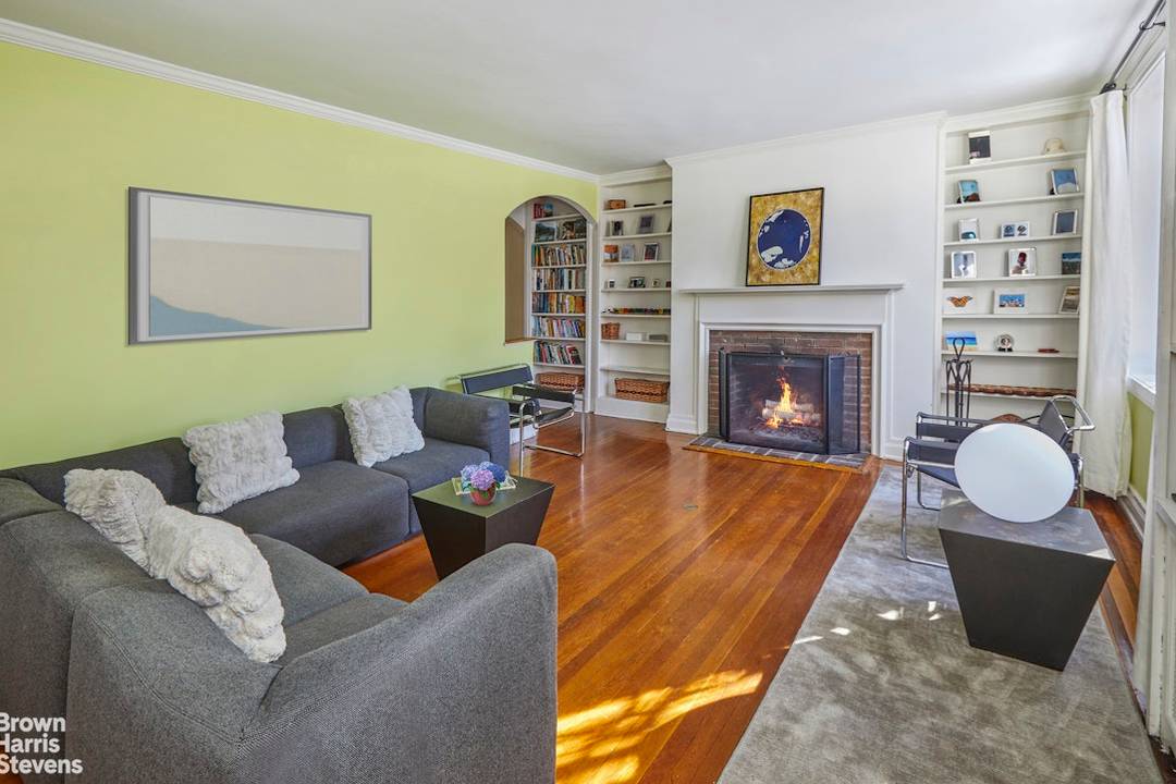 This beautiful English Garden Home, built in 1935, is located on one of the prettiest blocks in the coveted Historic District of Jackson Heights.