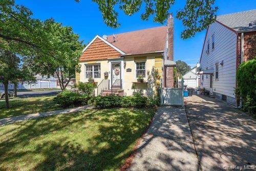 Welcome to this beautifully maintained Cape style home situated on a spacious 40x100 corner lot in the heart of Auburndale, Flushing.