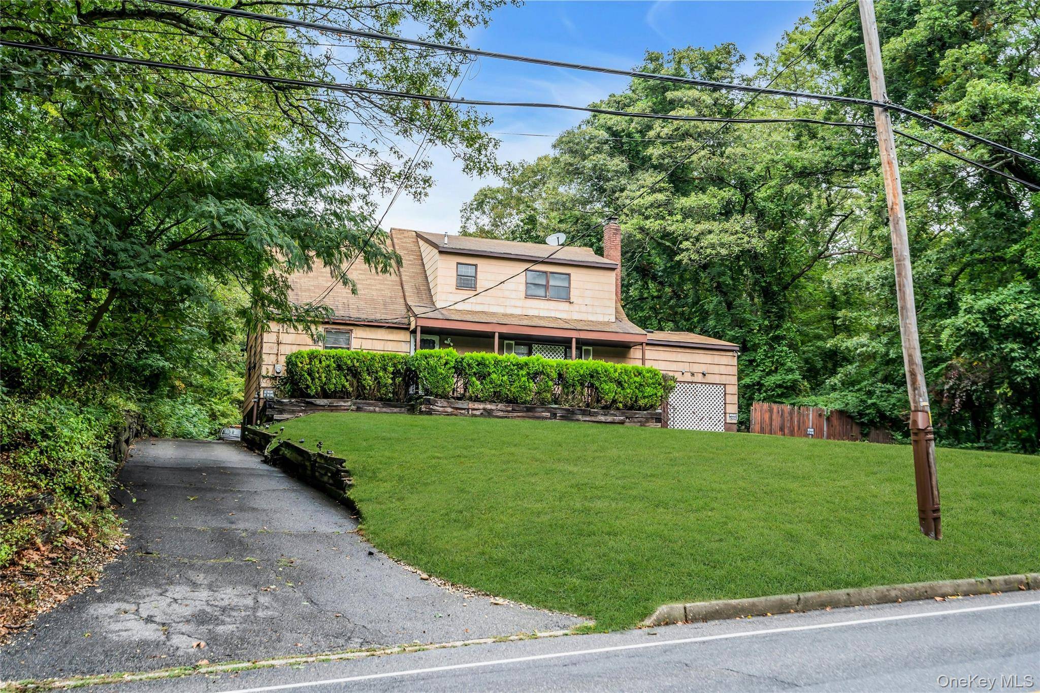 Great Opportunity with OVER 2 Acres in Prime Smithtown Location.