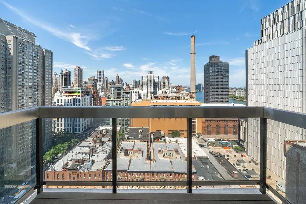 Enjoy your morning coffee on a private terrace with stunning East River and city skyline views.