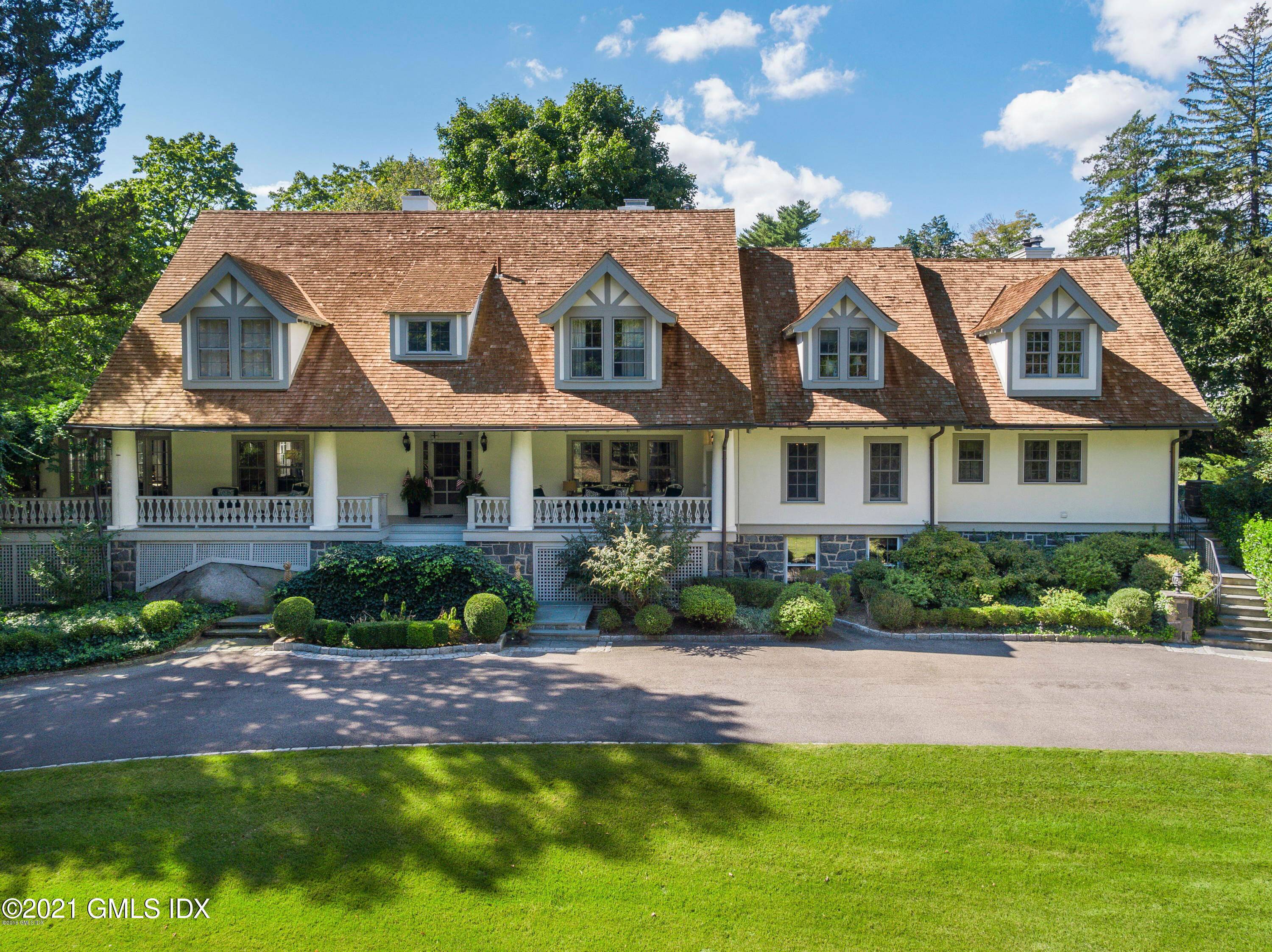 Private Rock Ridge Association elegant pre war Manor compound has 2 landscaped acres.