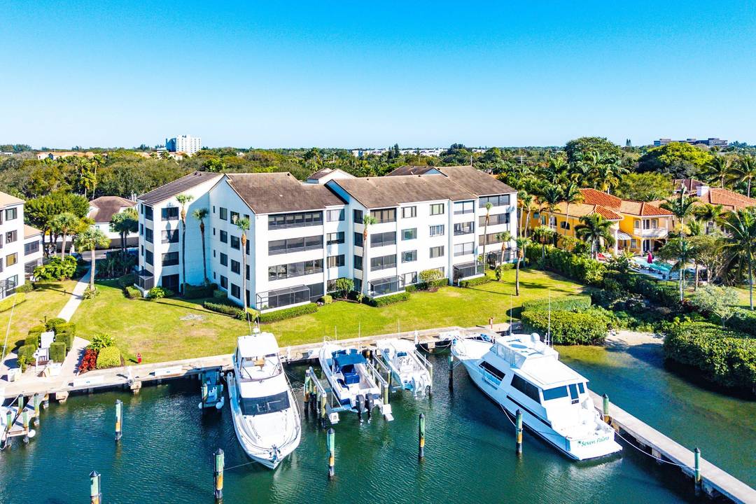 Wake up to shimmering Intracoastal views from the primary suite or unwind as yachts drift by from your expansive screened balcony.