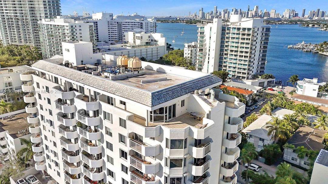 NEW PRICE ! Rare penthouse with an expansive private terrace and sweeping views from Biscayne Bay to the Atlantic Ocean.