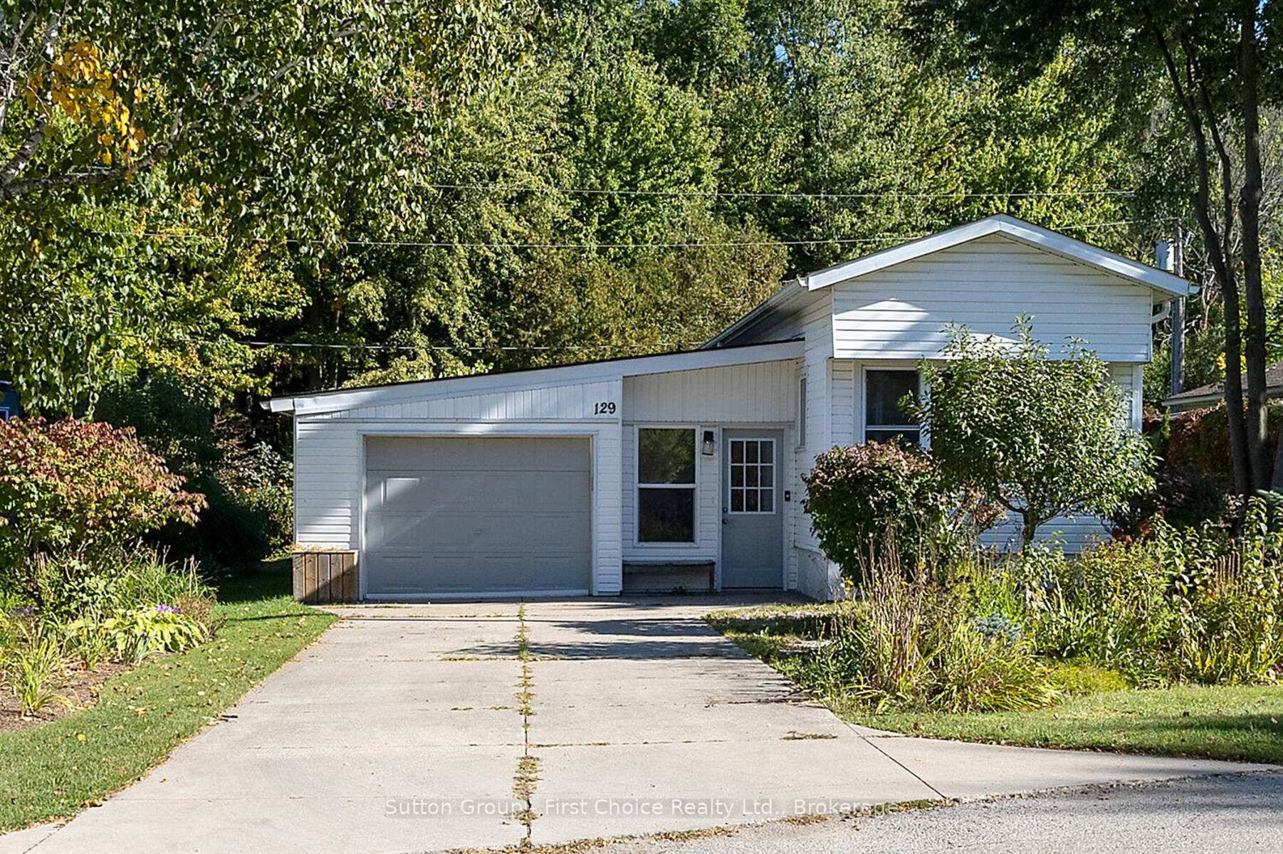 Welcome to this cozy and well situated mobile home nestled in a beautifully maintained community, backing onto a serene treed area for added privacy and tranquility.