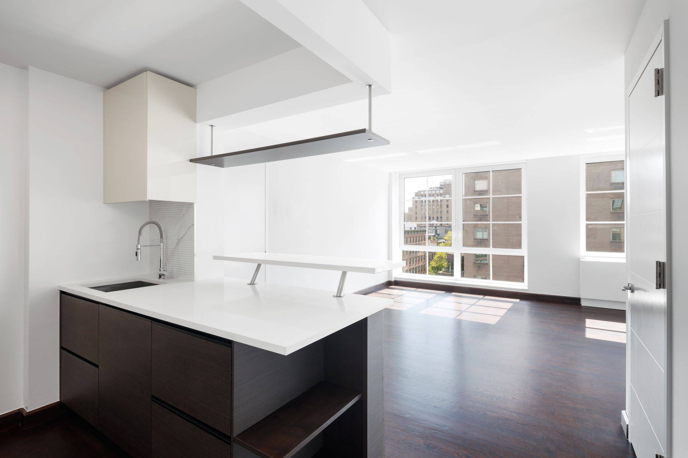 Spacious 1 bed with oversized windows showcasing open views.