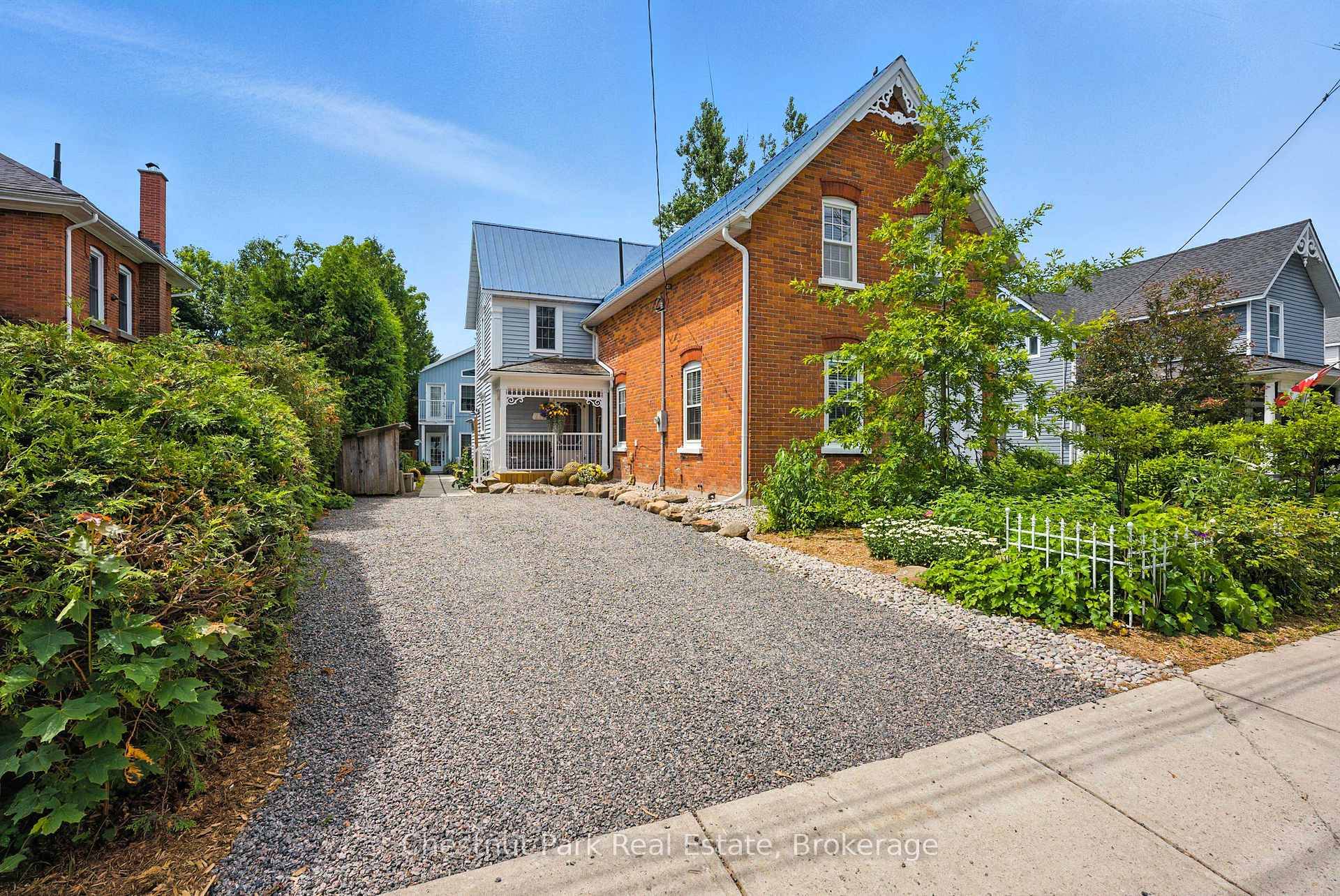 Charming Renovated Century Home with Carriage House, Commercial Potential amp ; Prime In Town Location.