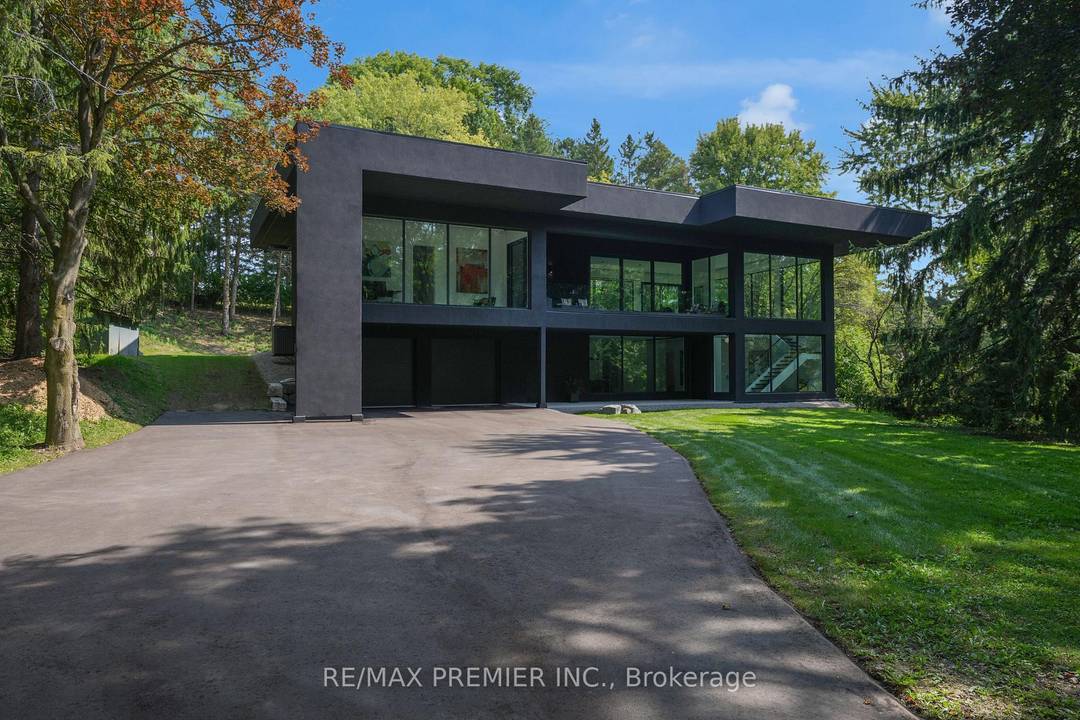 Discover a turnkey architectural masterpiece at 350 Kingscross Drive in the exclusive Kingscross Estates.