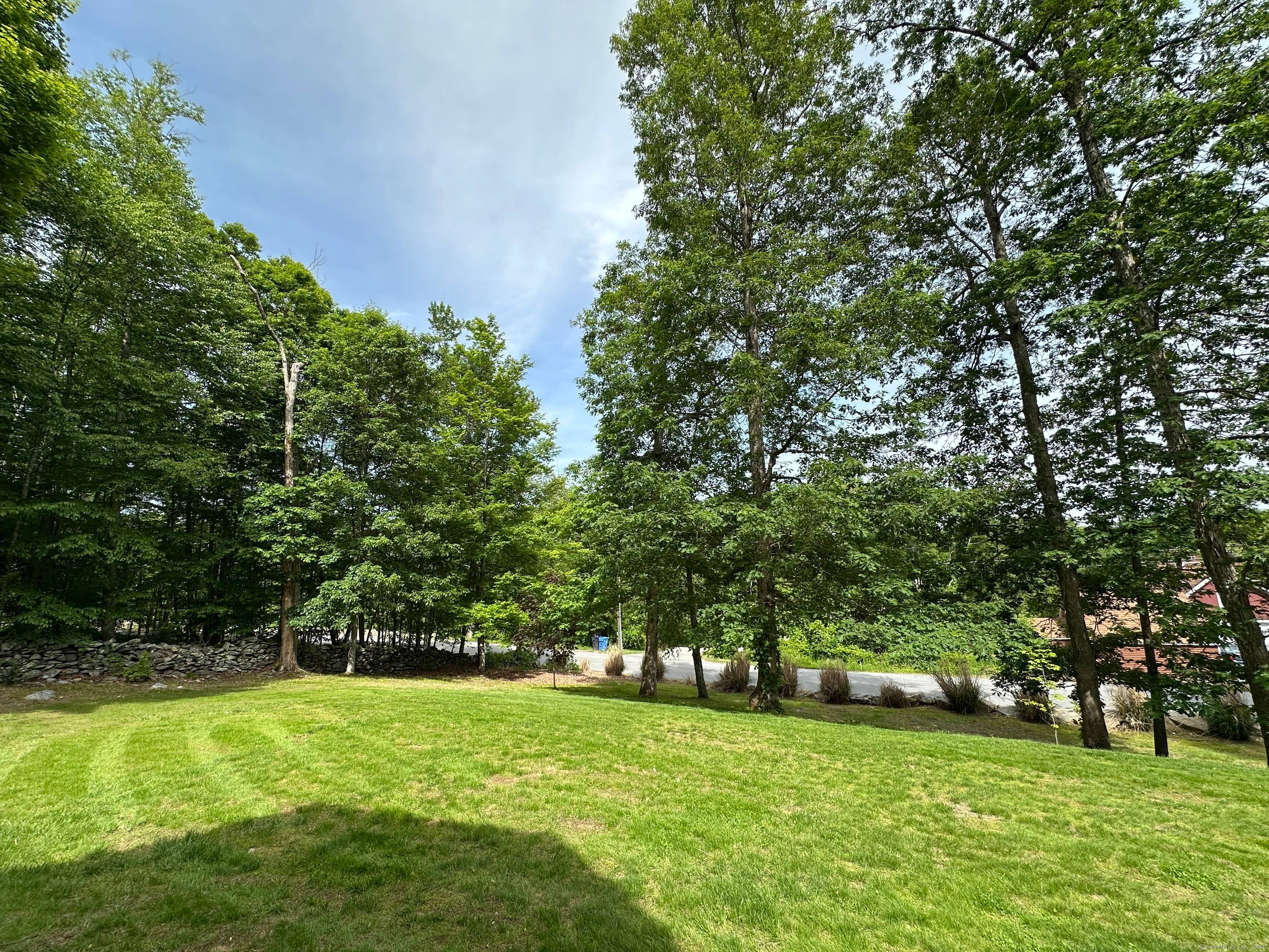 This is the one to see ! Welcome to this expansive and meticulously maintained raised ranch in the heart of Brooklyn, CT.