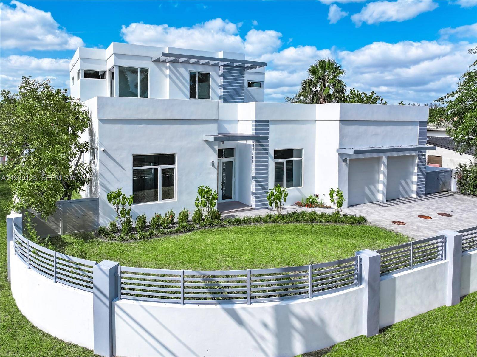 New, improved price. Experience luxury living in this NEW construction, rare, NO HOA, 2 story modern home in Doral s Vanderbilt Park.