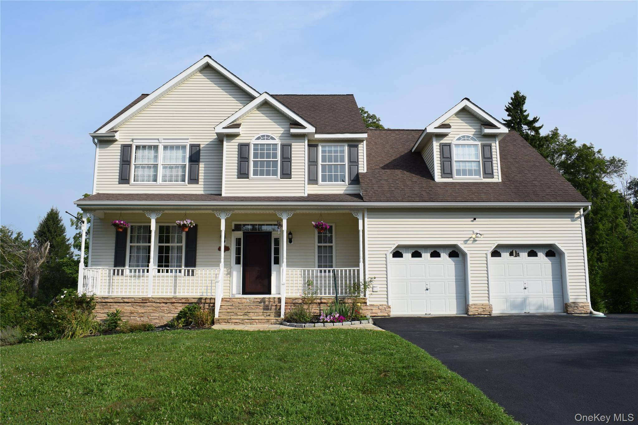 Beautifully Updated Colonial in LaGrange Nestled on a quiet cul de sac, this meticulously maintained Colonial offers a welcoming rocking chair front porch and an inviting, thoughtfully designed interior.