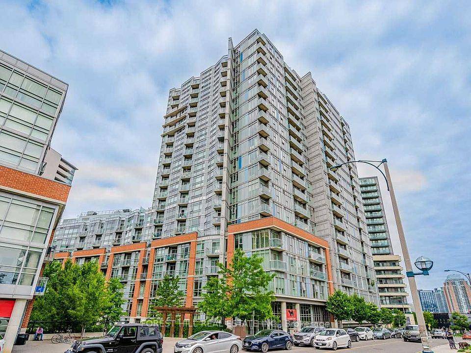 Bright and airy soft loft with polished concrete floors, exposed ceilings, and expansive floor to ceiling windows creating a striking industrial aesthetic.