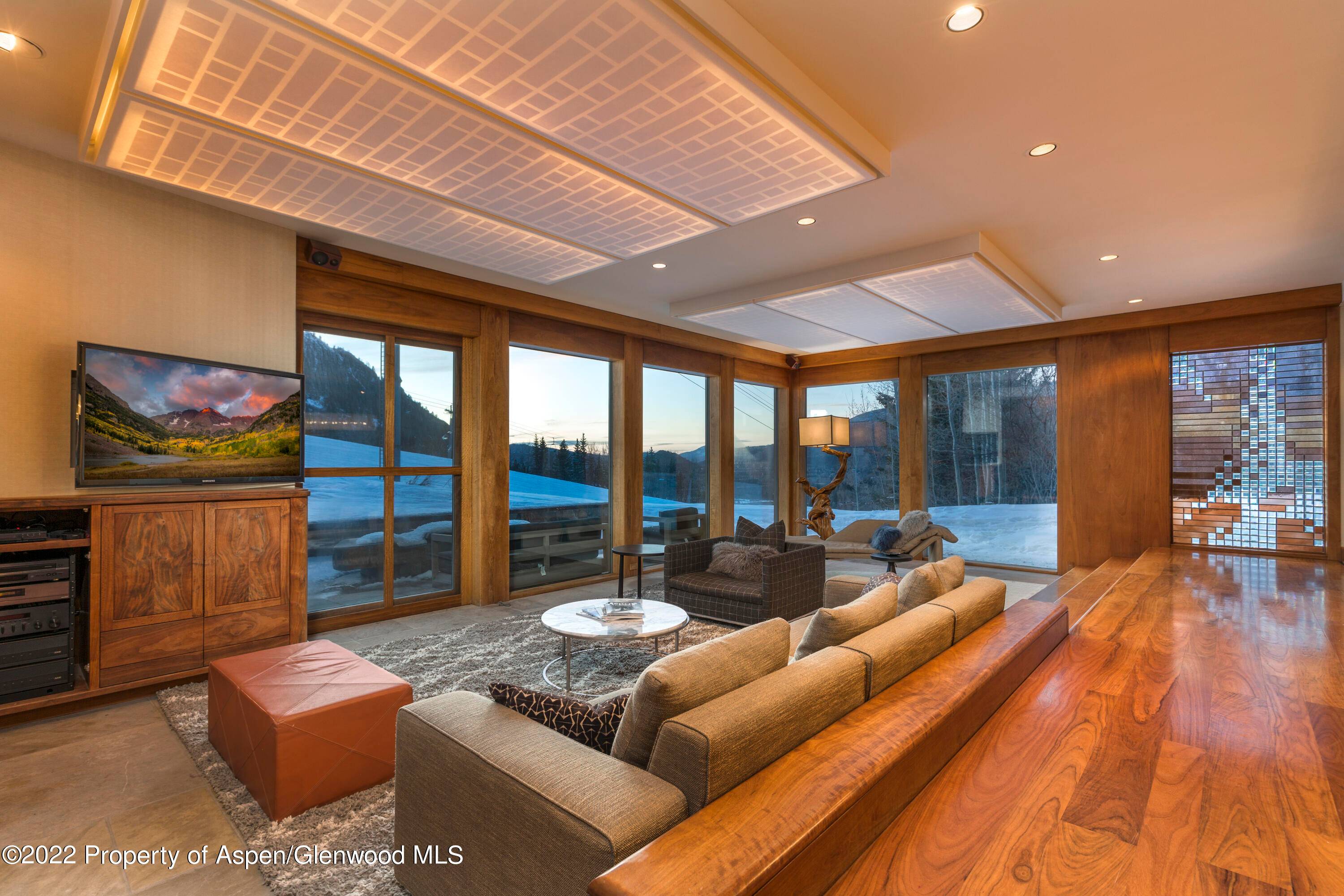 This Incredible three bedroom slope side flat on Aspen Mountain offers a beautiful stone patio, fire pit, and outdoor seating.
