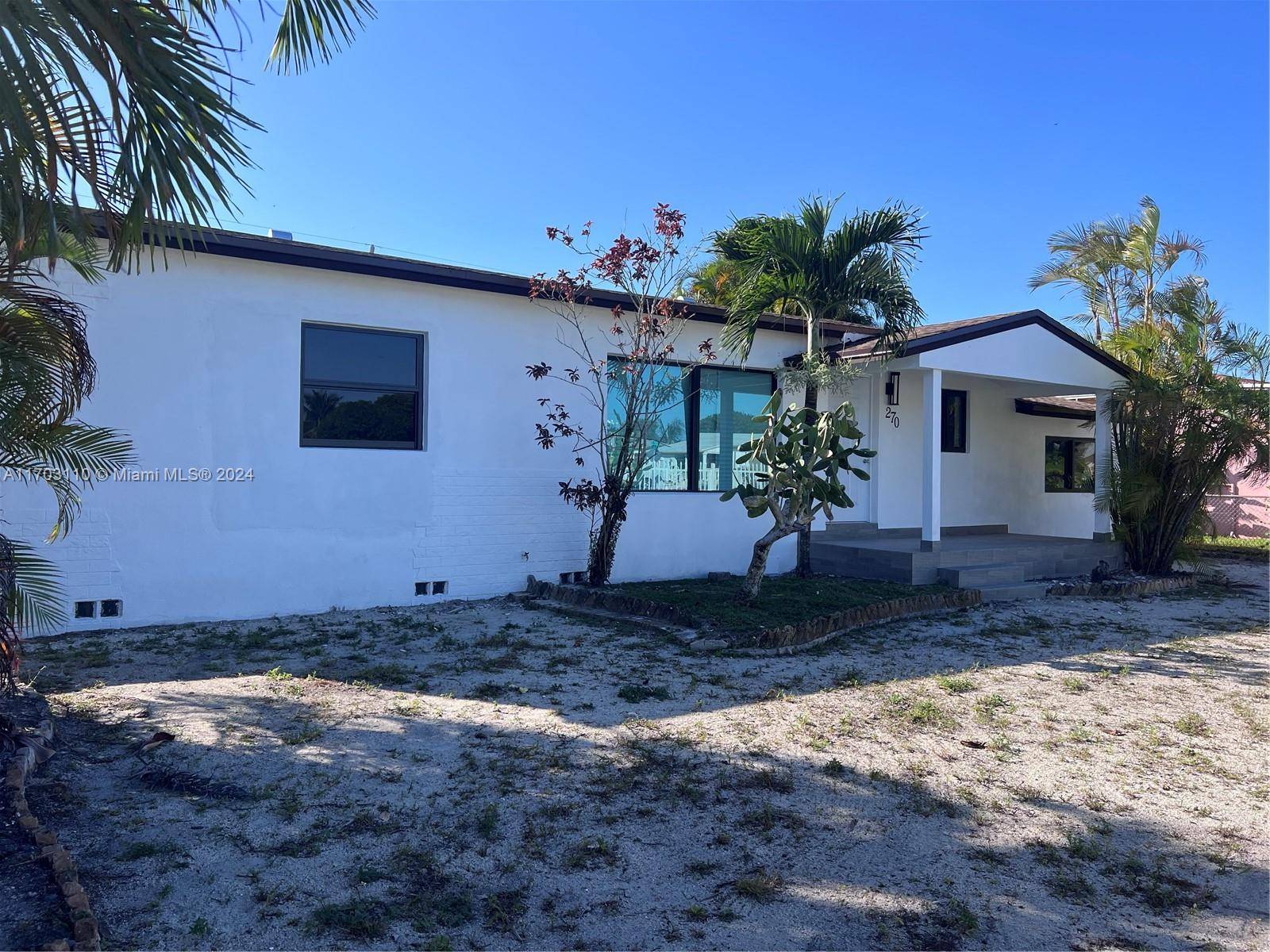 Step into this beautifully remodeled home, complete with new roof and all impact windows and doors.