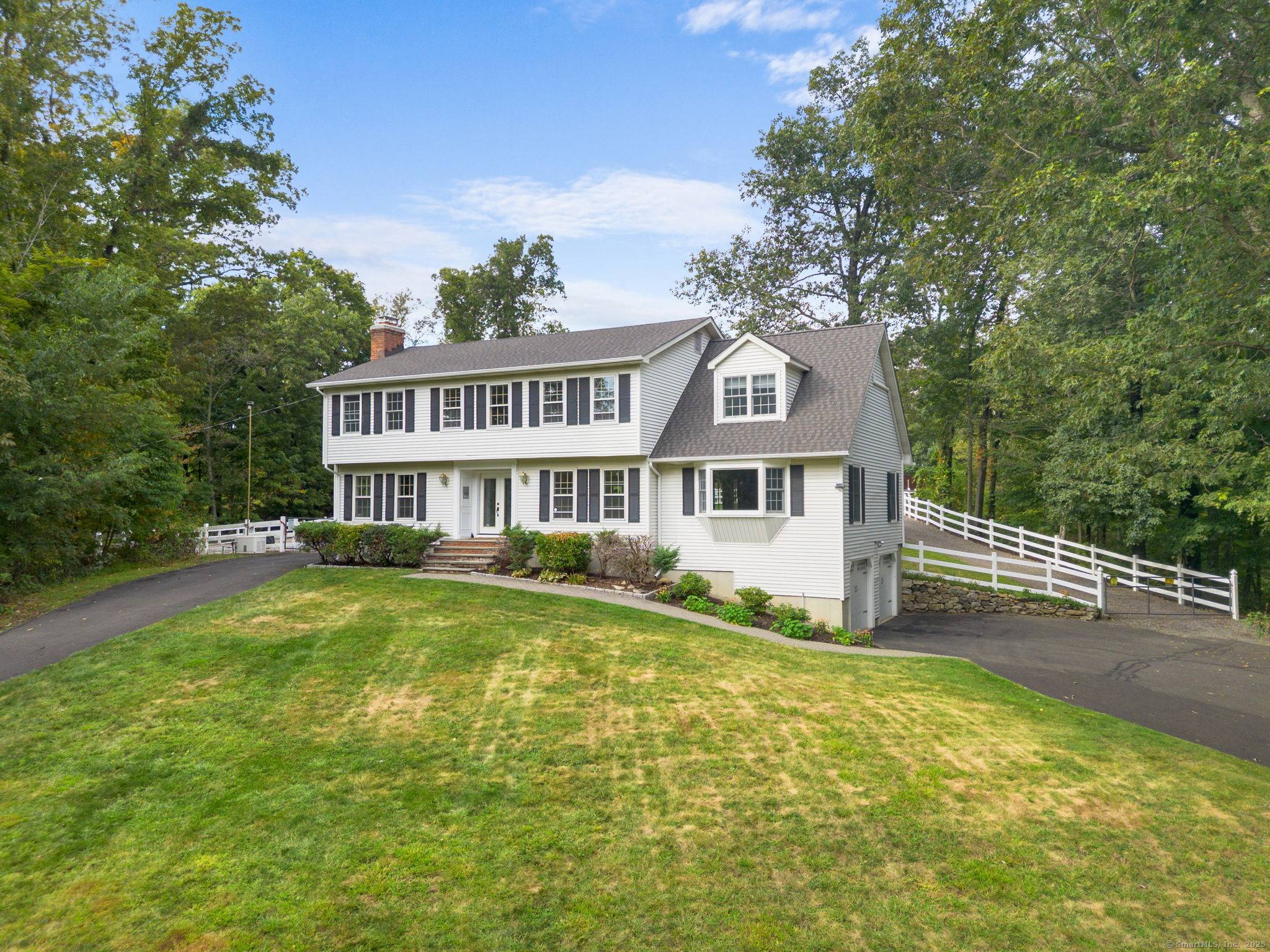 Tucked away at the end of a quiet cul de sac in one of New Fairfield's westside neighborhoods, this exceptional 5.