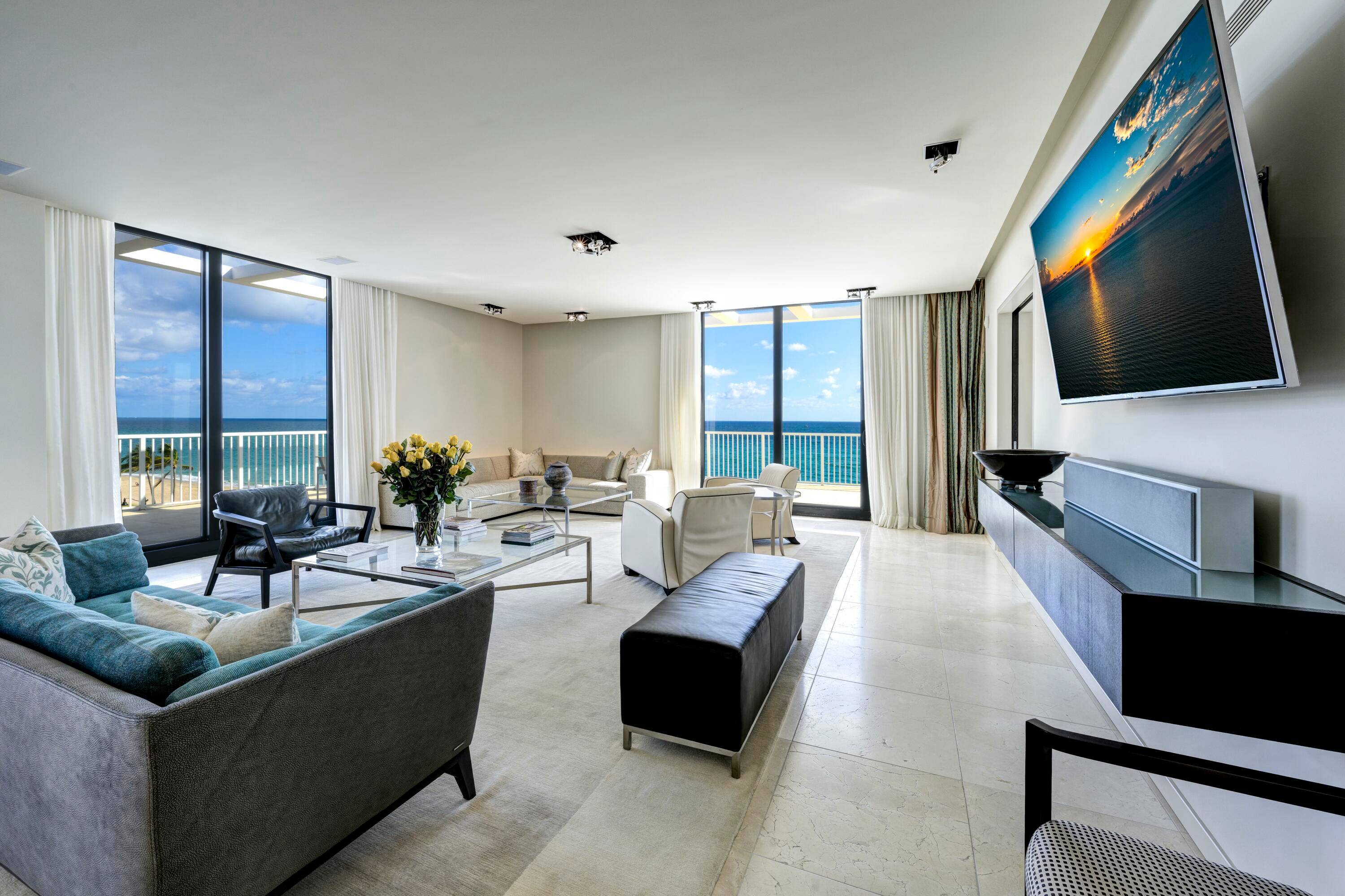 Discover the epitome of seaside luxury in this direct oceanfront corner penthouse, where exceptional living meets modern elegance.