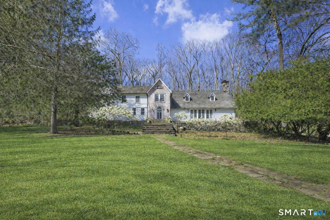 Set on a private, wooded property in a prime Stamford location, this residence blends architectural character with exceptional indoor outdoor living.