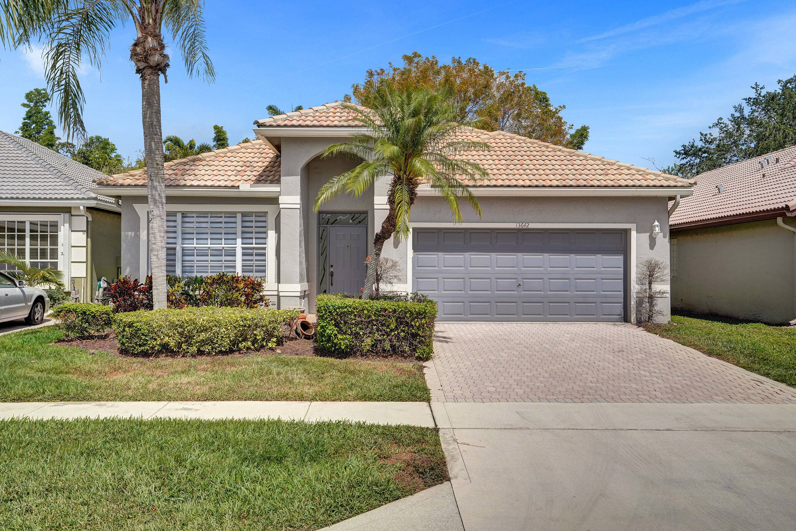 Live the resort lifestyle in this beautifully remodeled 4 bed, 2 bath home in the prestigious gated community of Polo Trace in Delray Beach.
