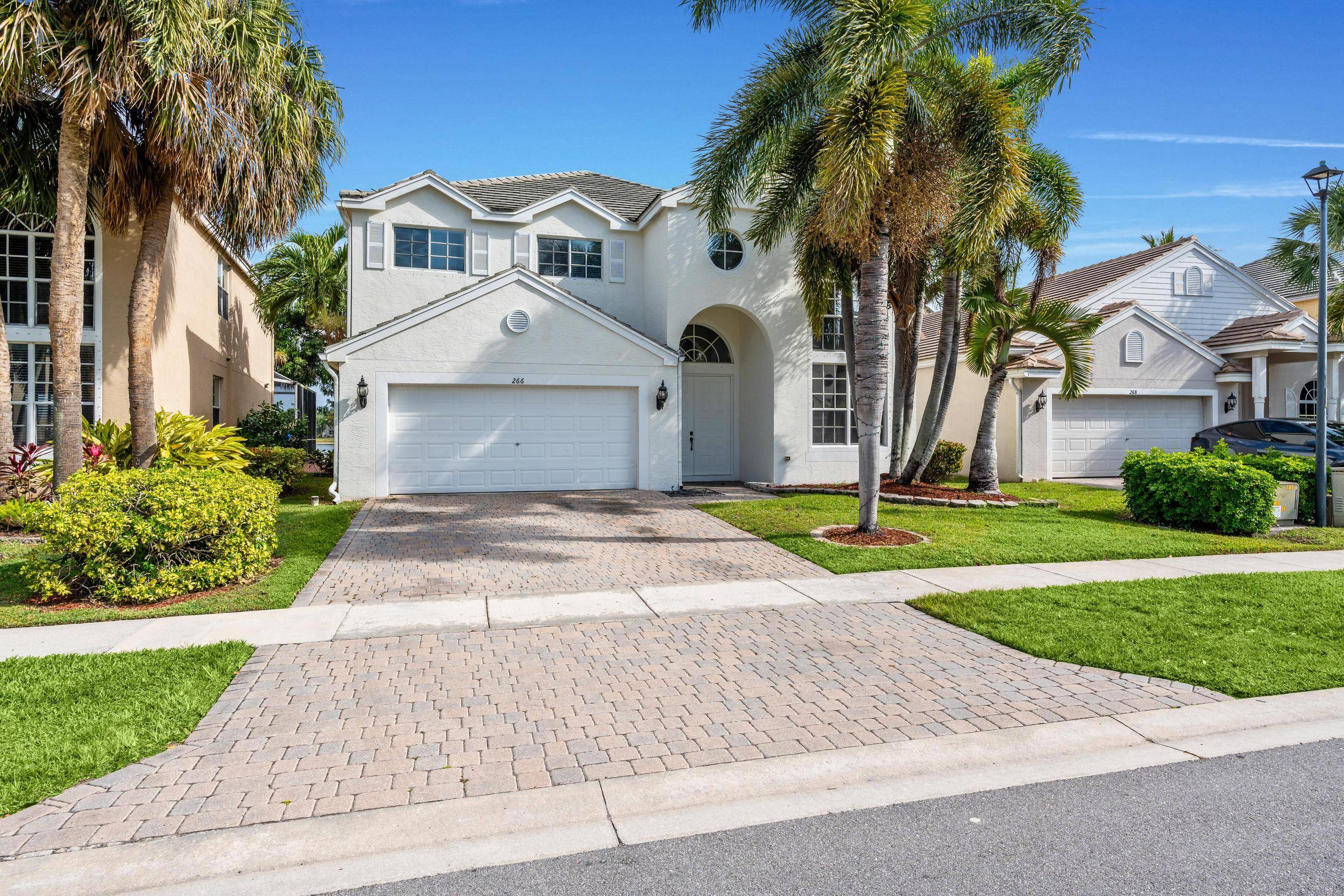 This 4 bedroom 3 bathroom home with stunning lake views has formal living room with soaring ceilings that opens to a spacious kitchen and family room.