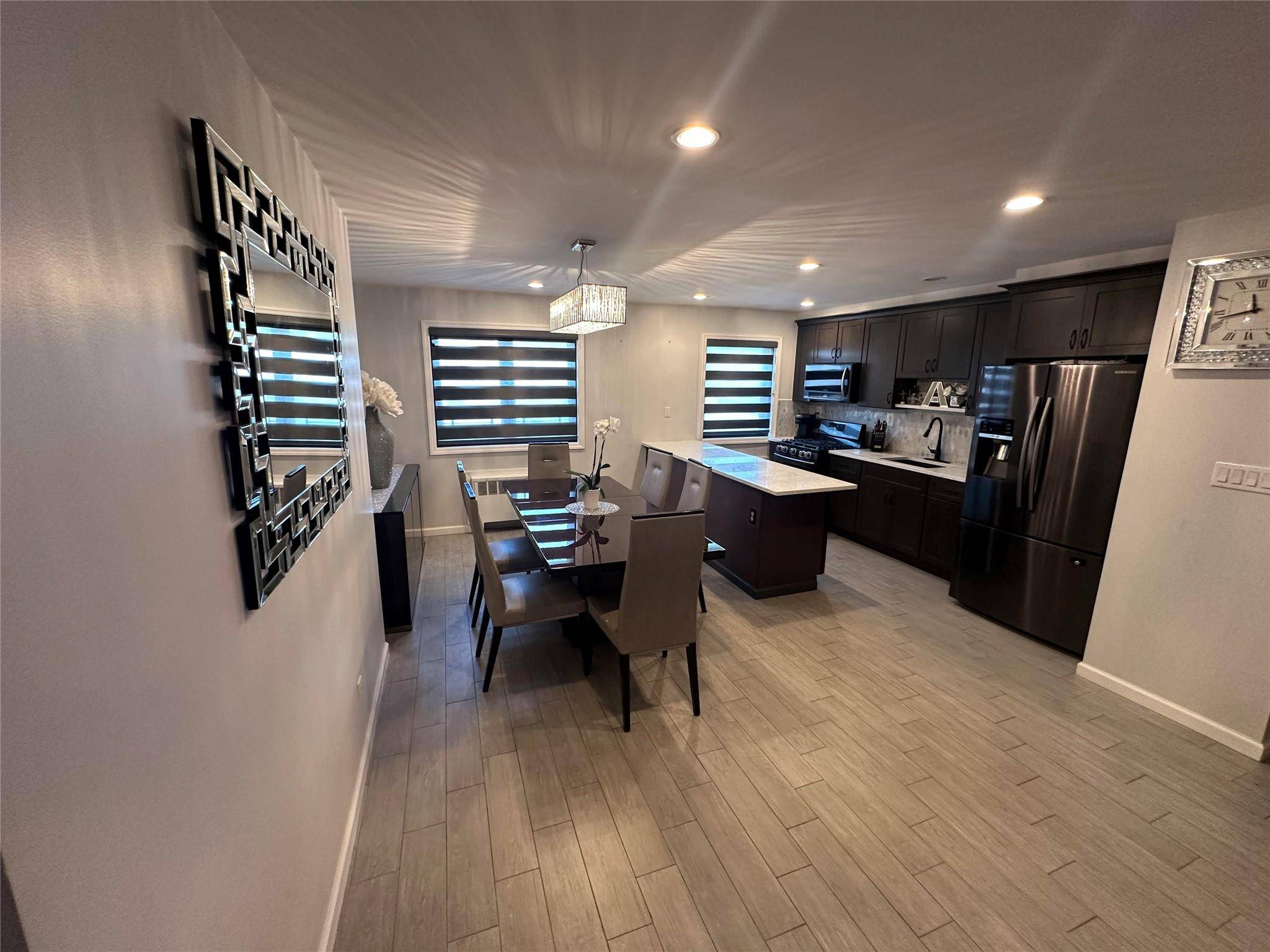 Discover this beautifully renovated modern unit, offering two bedrooms and two bathrooms originally a three bedroom layout that was thoughtfully converted to create a spacious formal dining area.