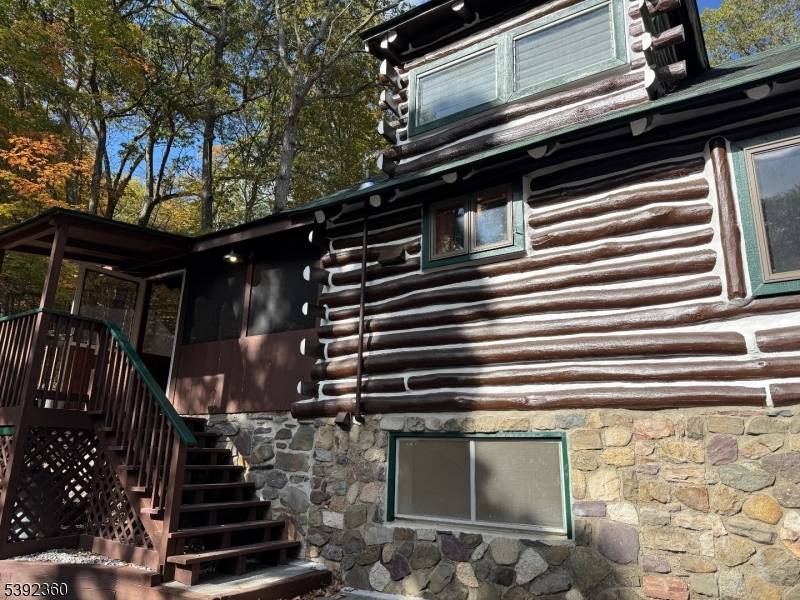 Enchanting log cabin home, tucked away at the end of a quiet road, backed by the Abraham Hewitt State Forest hiking trails.