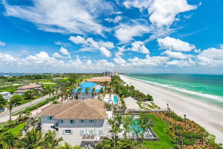 Experience the best of Longboat Key living in this beautifully updated, turnkey furnished 2 bedroom, 2 bath residence located behind the gates of the sought after Longboat Key Club.