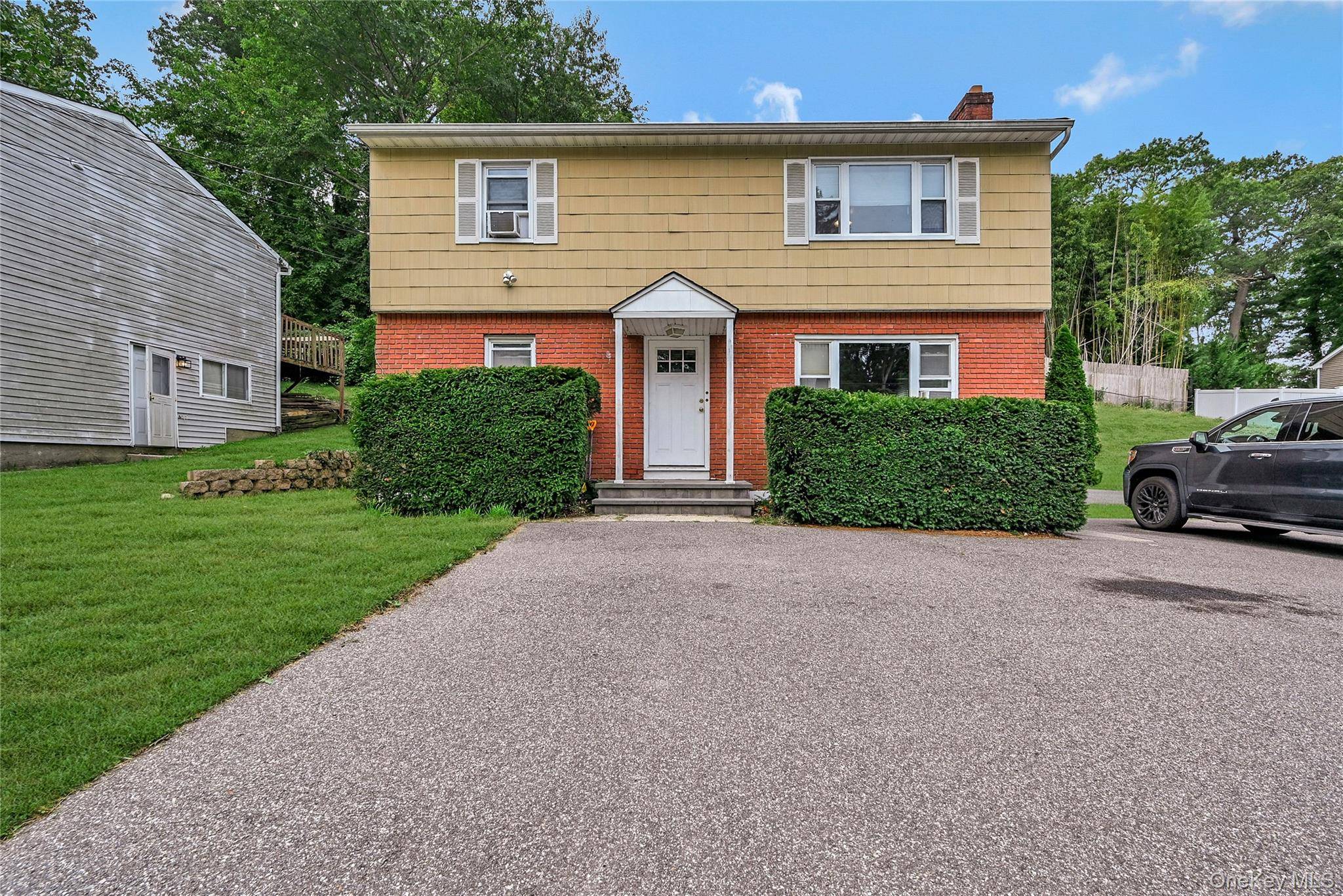 Welcome to this legal two family home in the heart of East Northport !