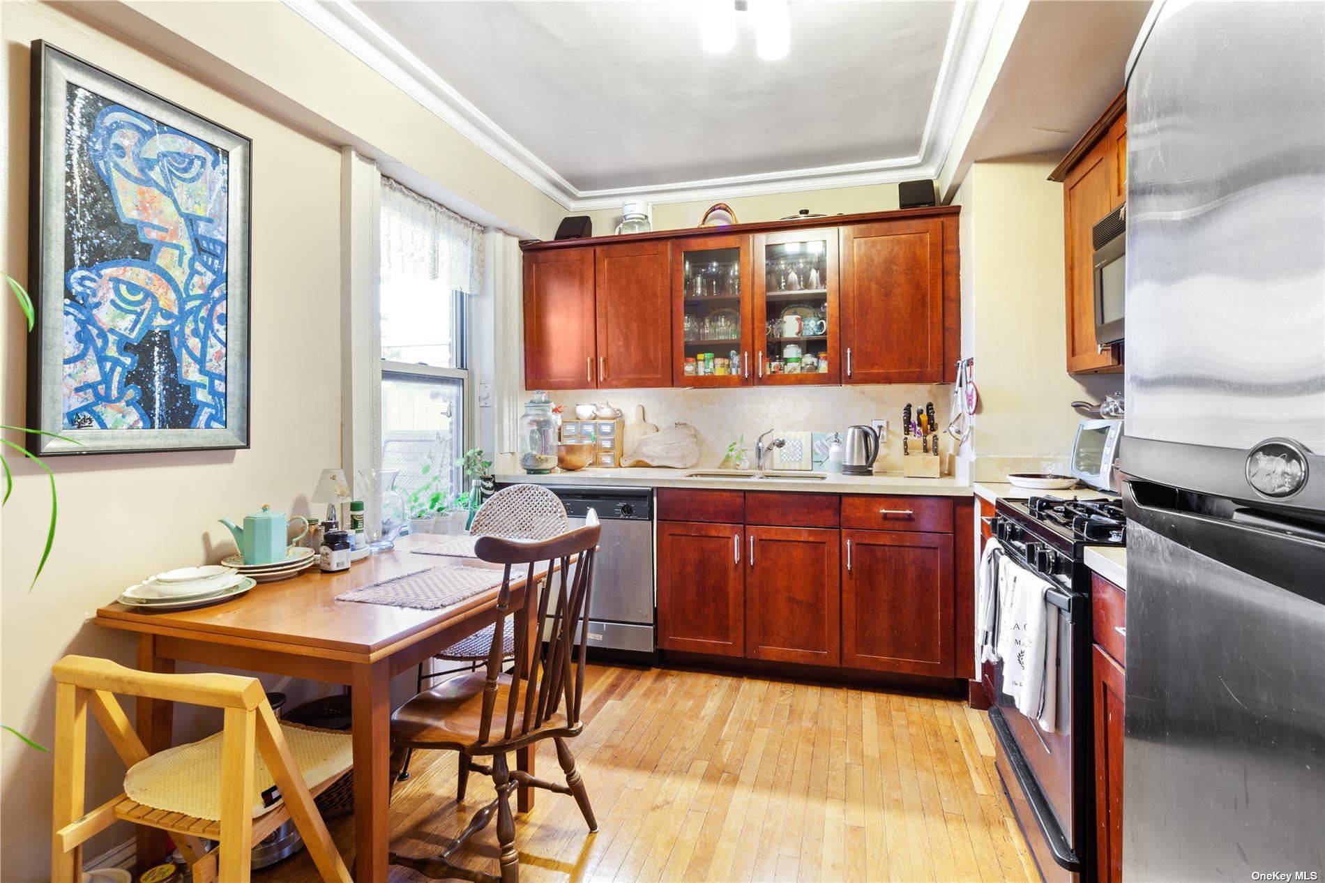 Immerse yourself in charming Forest Hills life with this expansive duplex apartment.