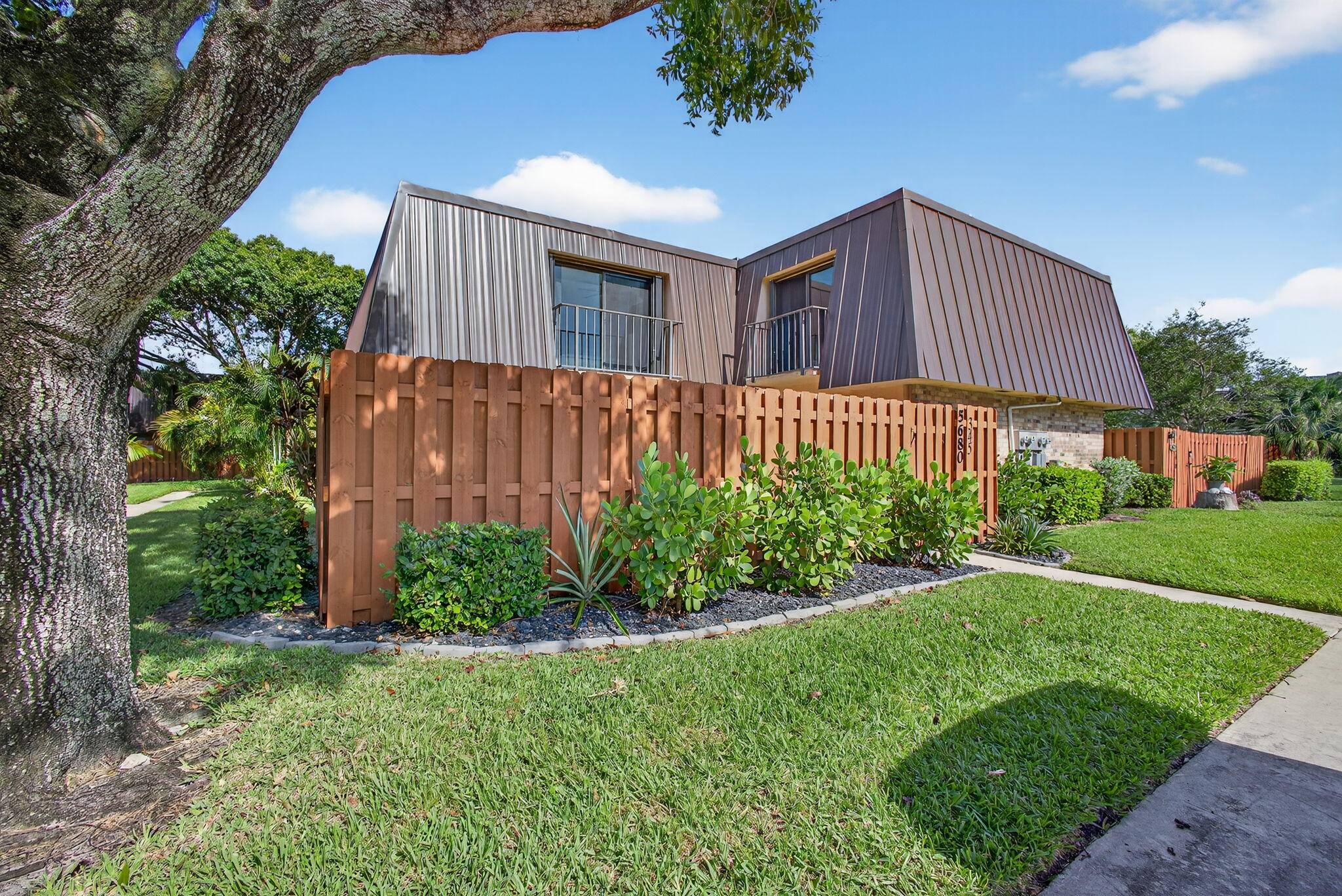 Welcome to 5680 SE Windsong Ln 345, a beautifully maintained 2 bedroom, 2 bath townhome offering 1, 288 sq ft of stylish living space in the gated community of Emerald ...
