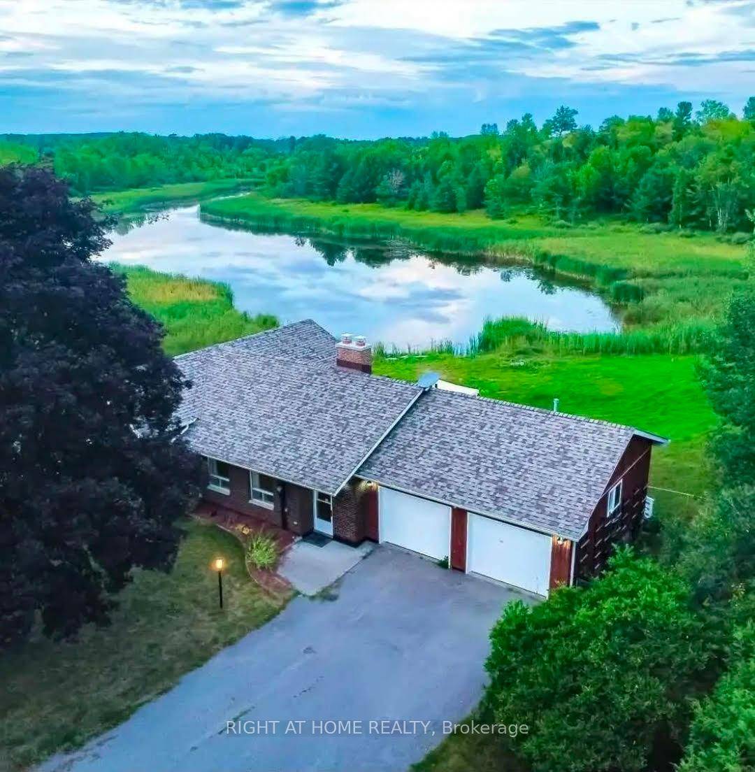 Spectacular Private Retreat in Campbellford, Over 15 Acres with an 8 Acre Spring Fed Pond.