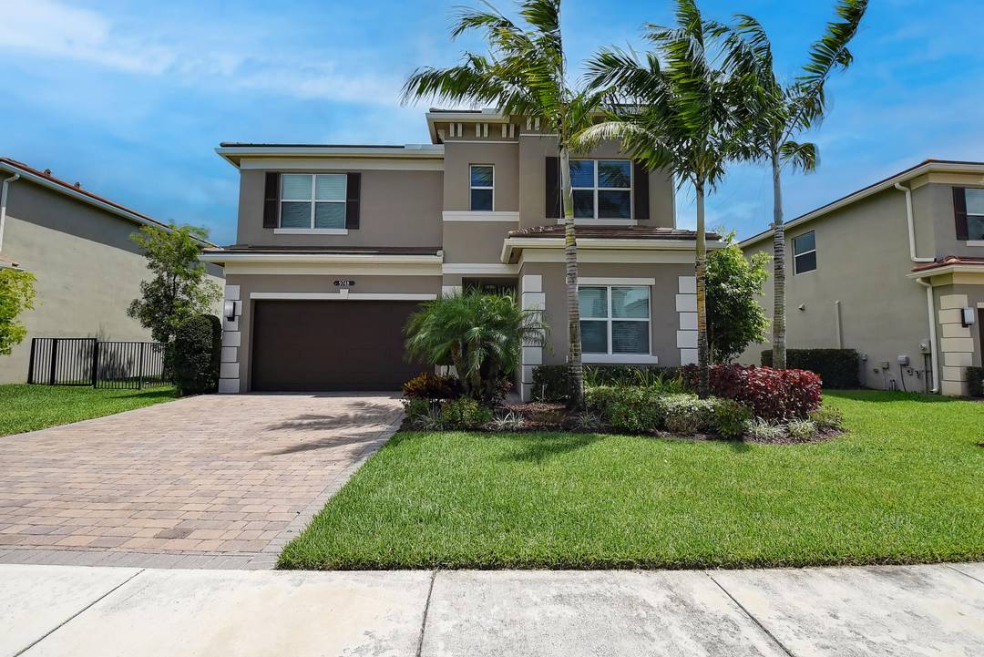 Much sought after Dakota of Delray Beach Siena model type home situated on a tranquil piece of property with lake view.