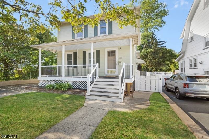 Welcome to this charming colonial that perfectly blends timeless character with modern updates.