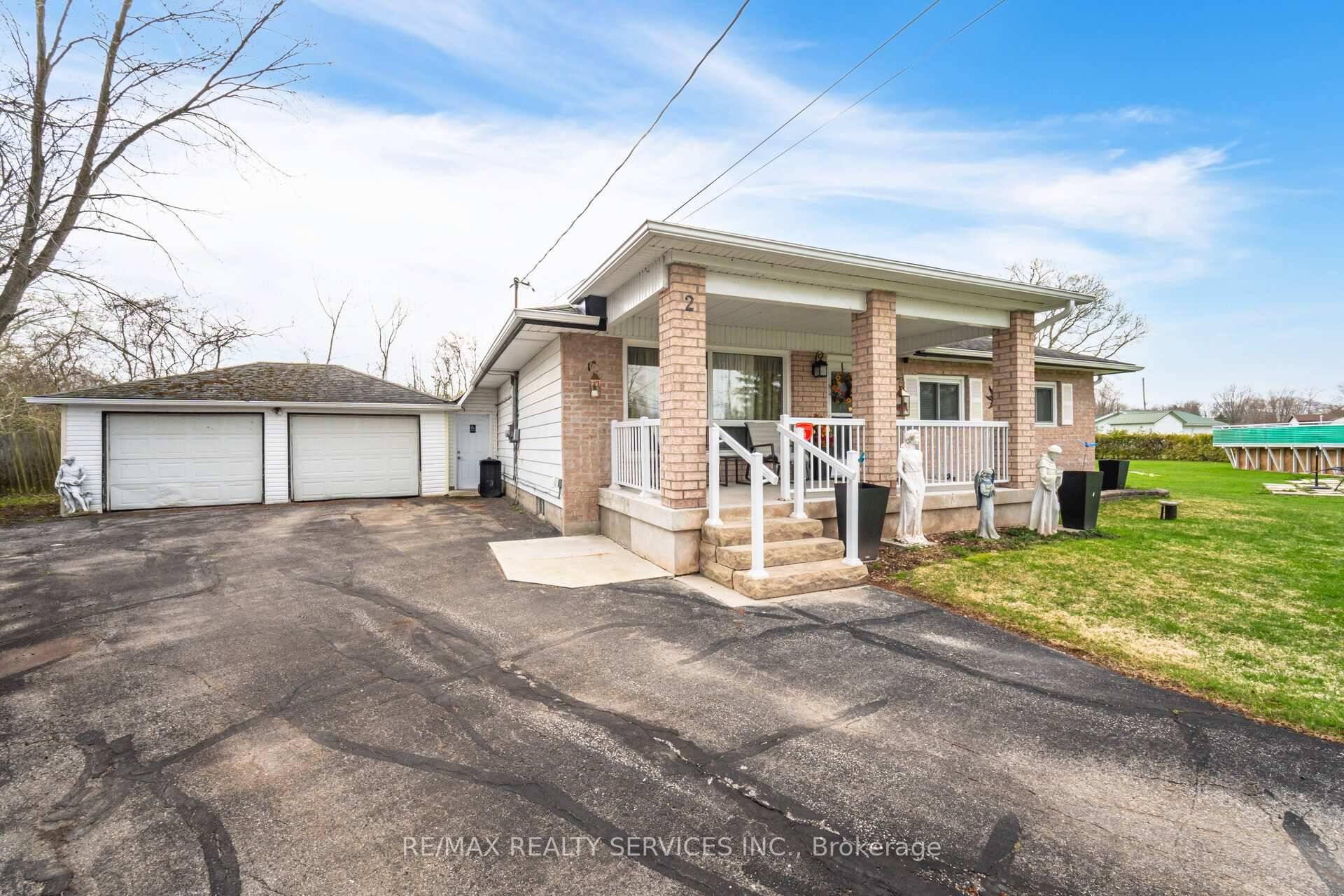 Can't miss this one ! Beautifully maintained 2 car garage bungalow on approx.