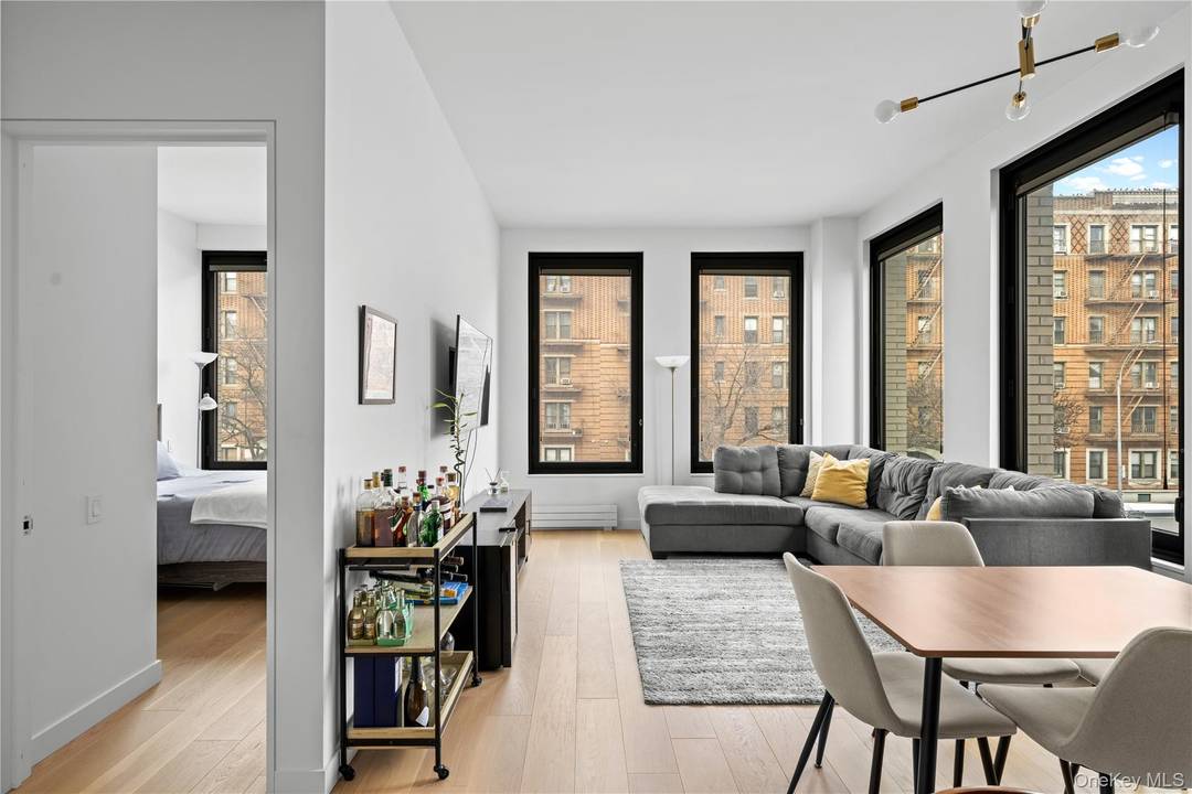 Welcome to this beautifully appointed one bedroom, one bath corner residence at The Rowan.