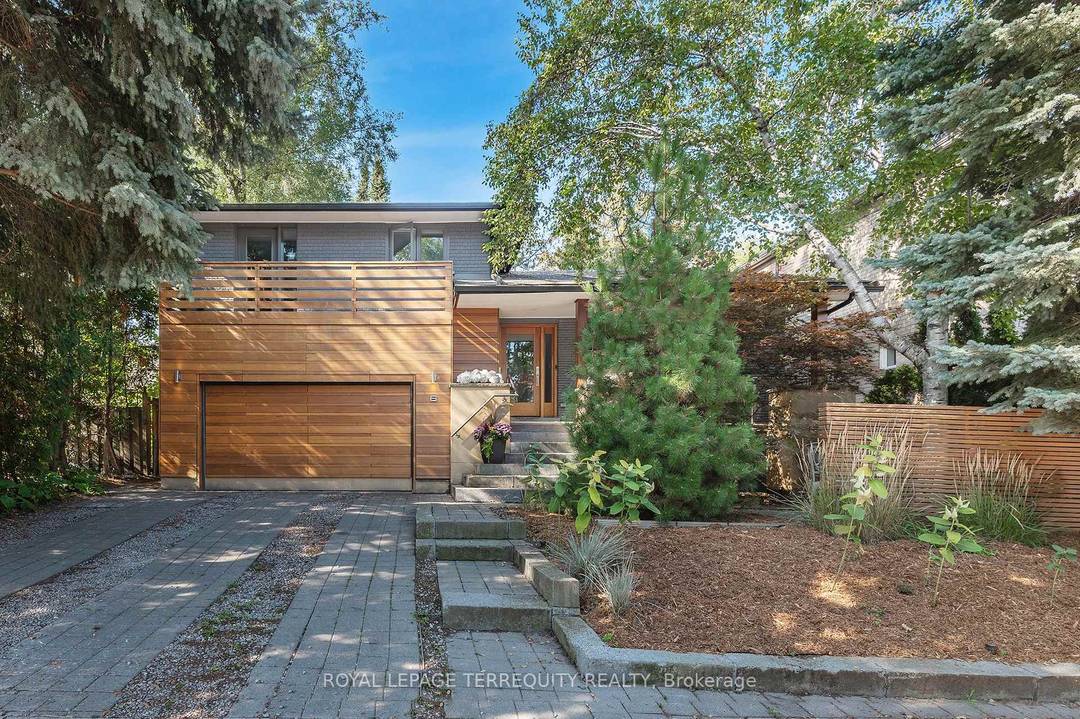 Mid century modern sanctuary in the heart of the Kingsway, set on a rare private 50 x 150 ft park like lot.