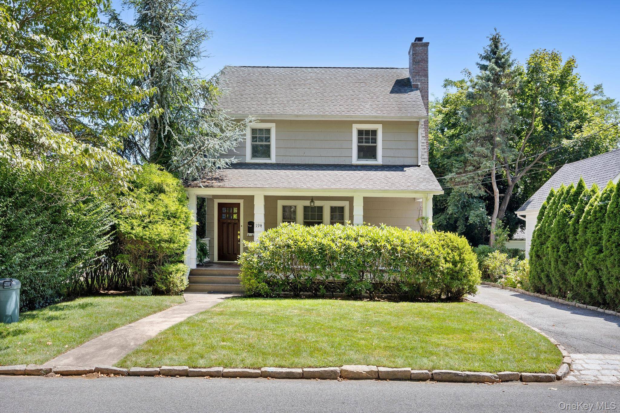 Beautiful front porch Colonial right in front of Davis Park.