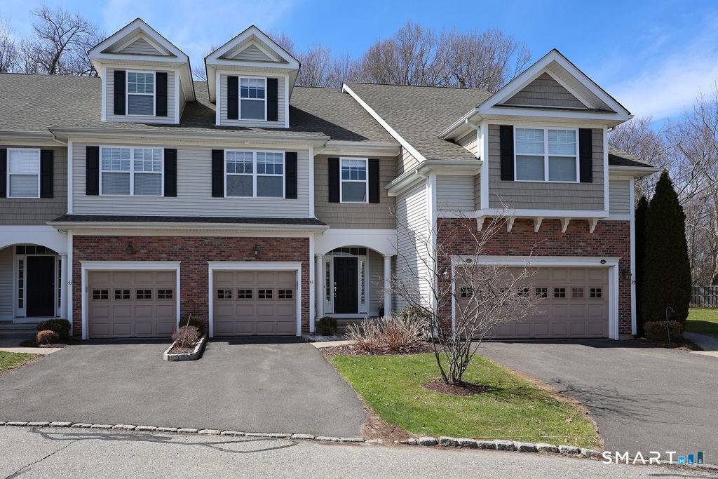 Elegant, light filled rarely available condo in sought after Quaker Green !